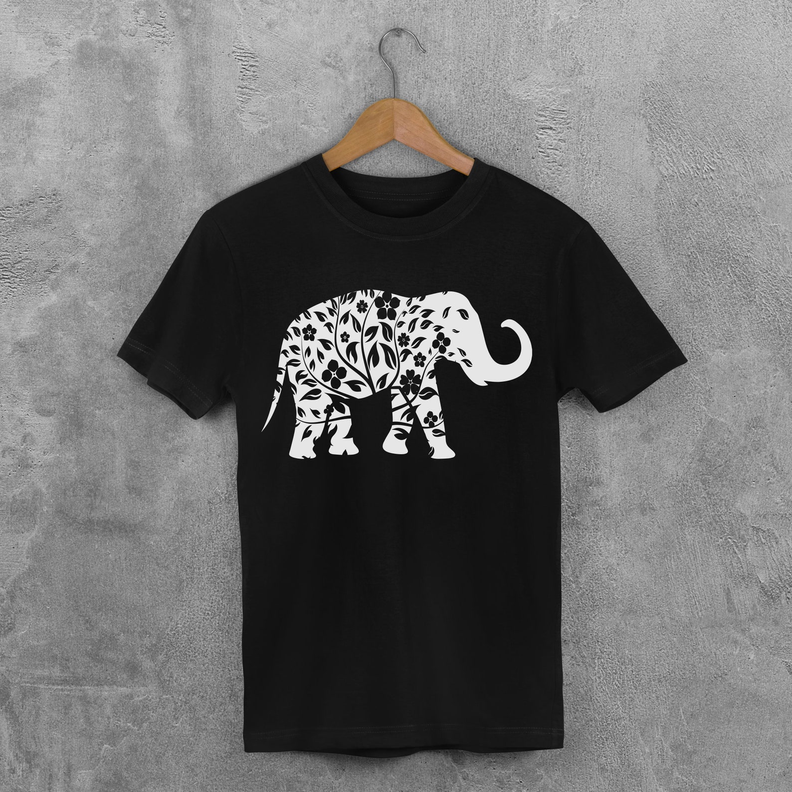 Black t - shirt with a white elephant on it.