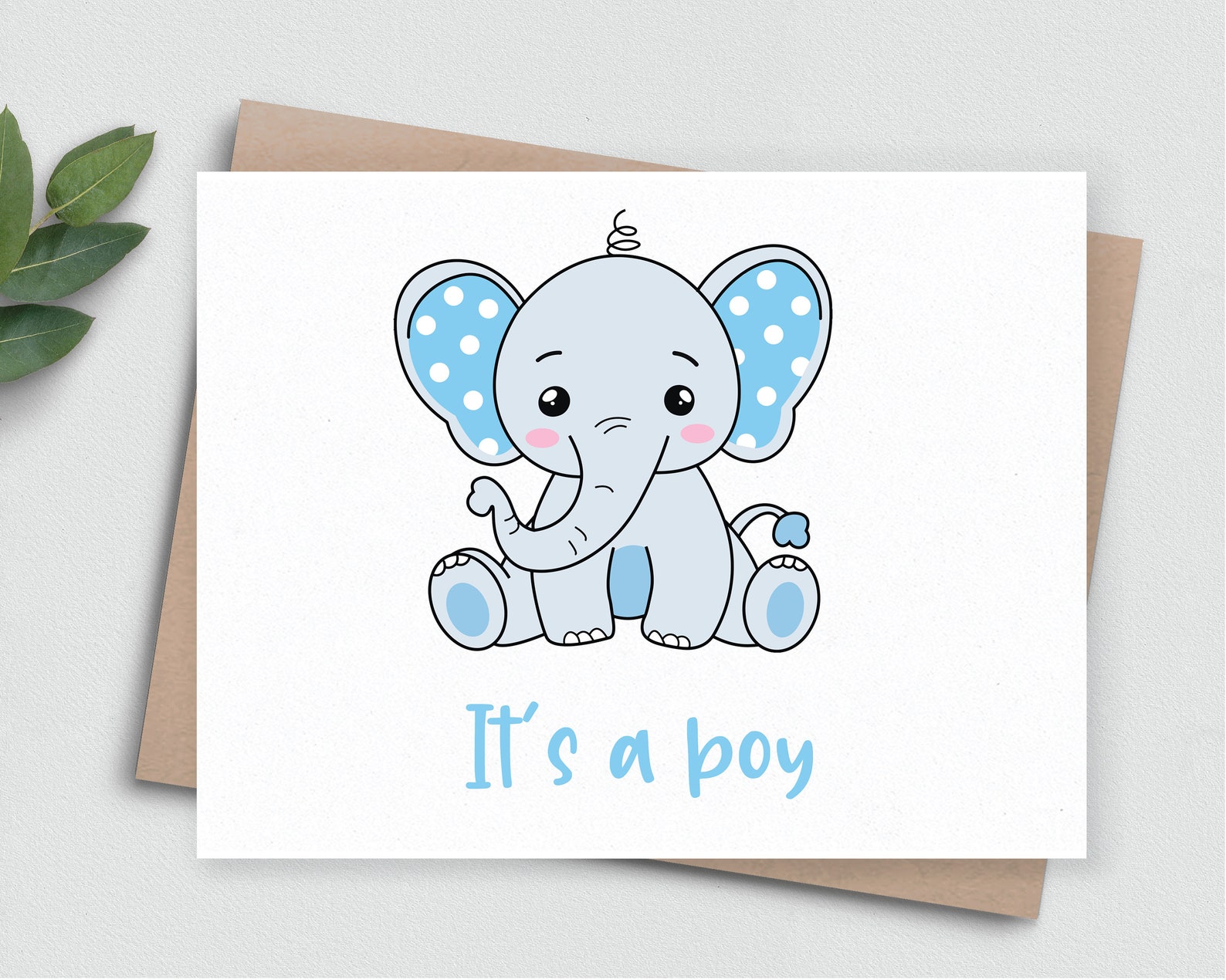 Card with a baby elephant sitting on top of it.