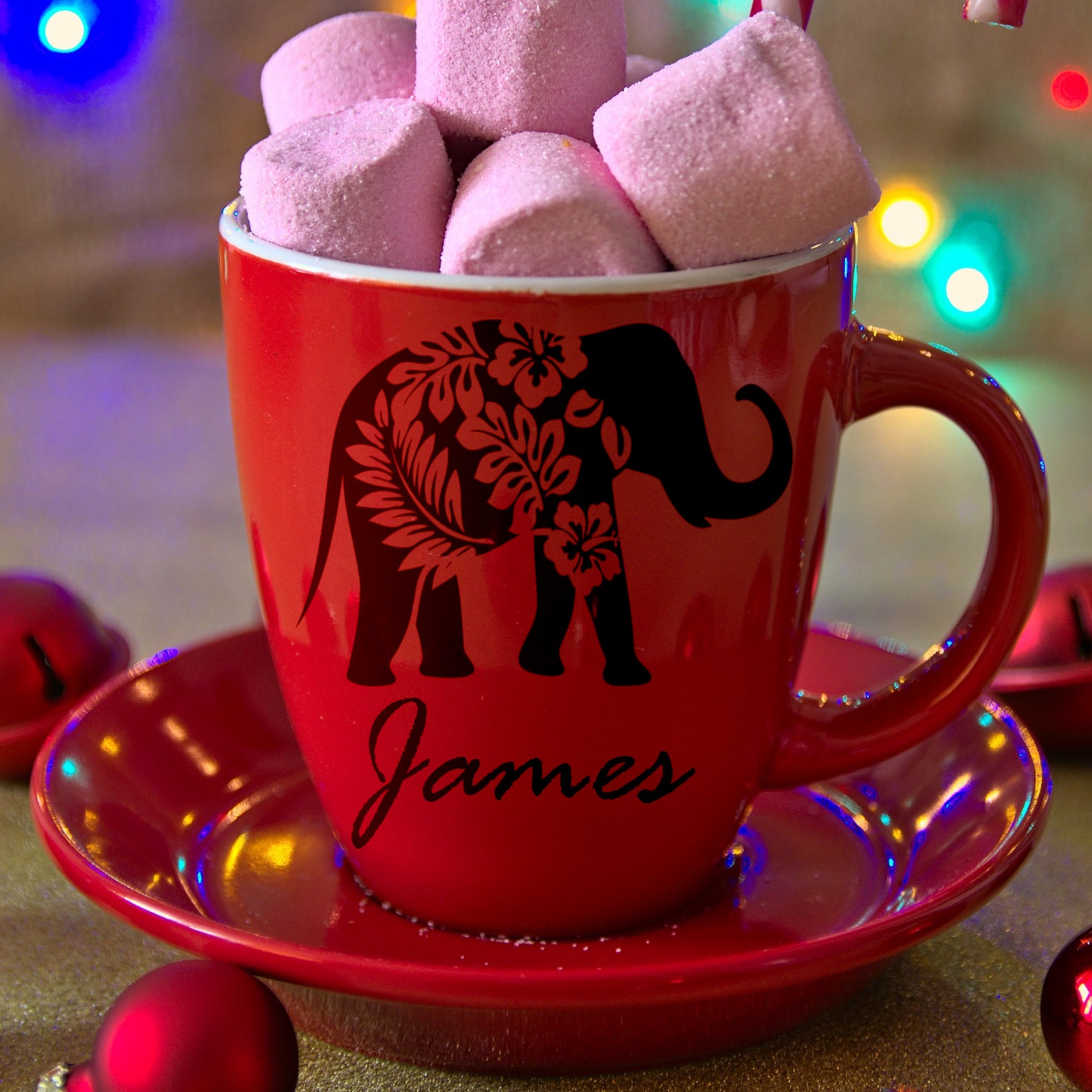 Red cup filled with marshmallows on top of a saucer.