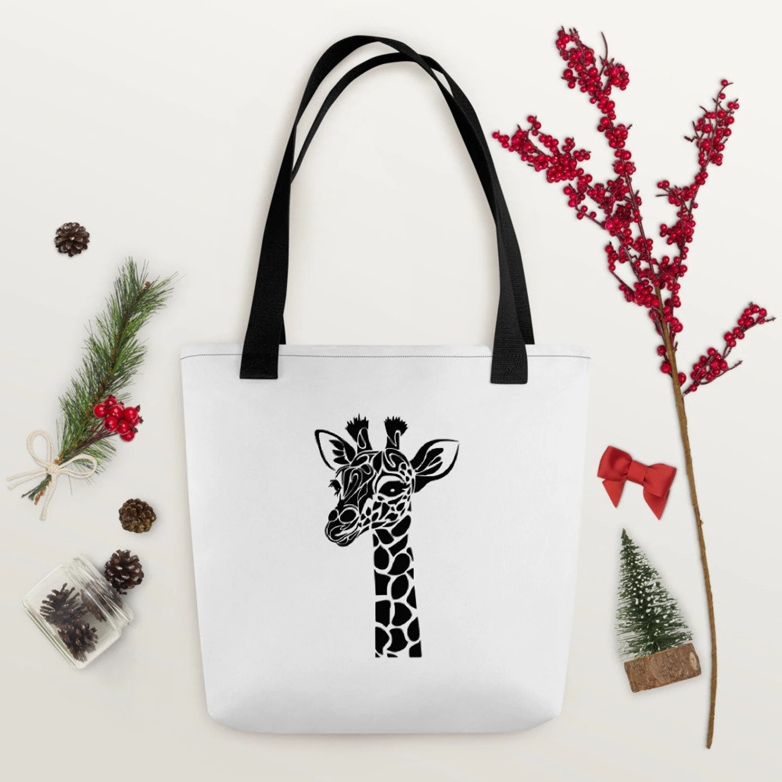 Tote bag with a giraffe design on it.