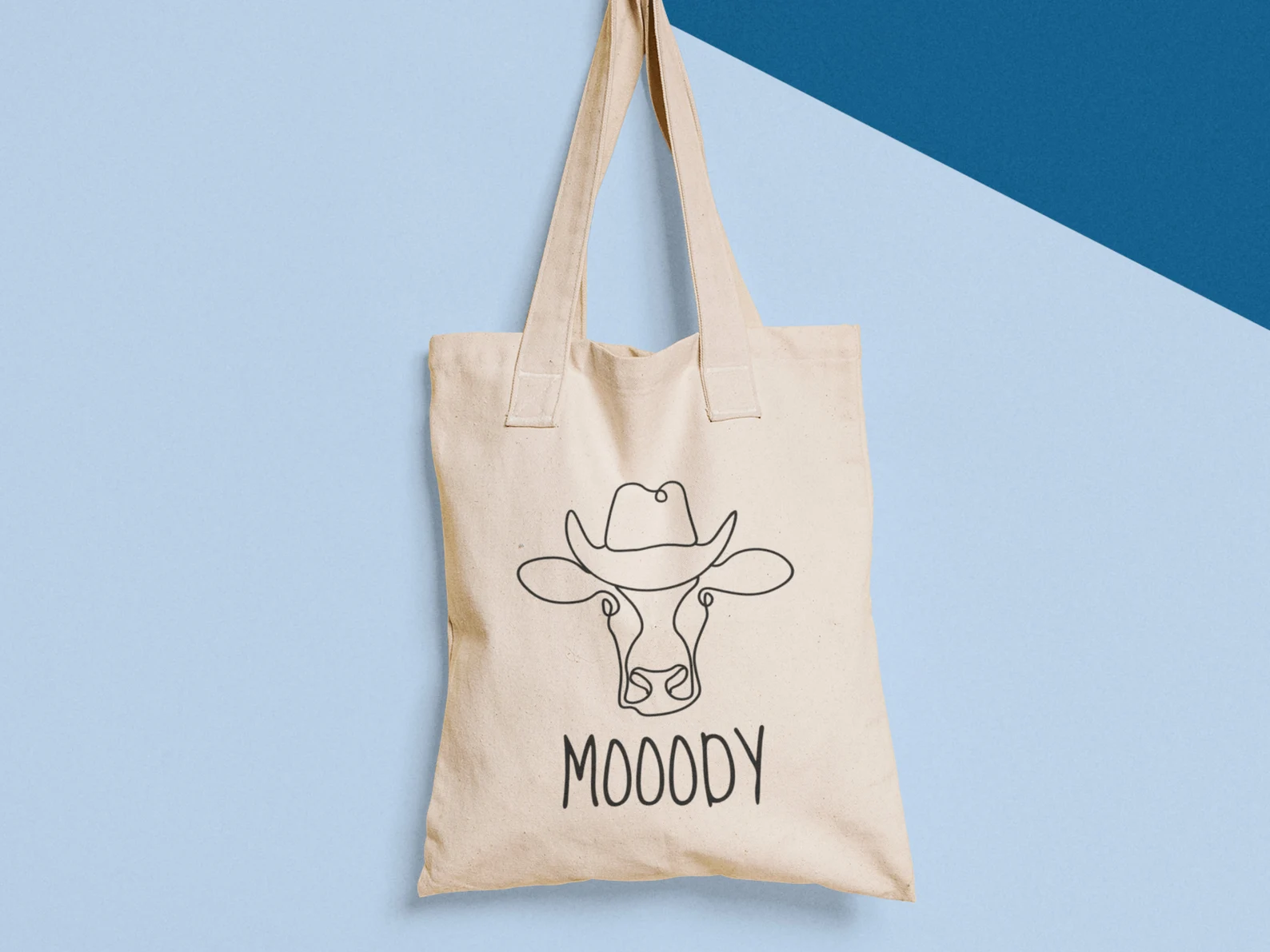 Beige eco bag with outline cow.