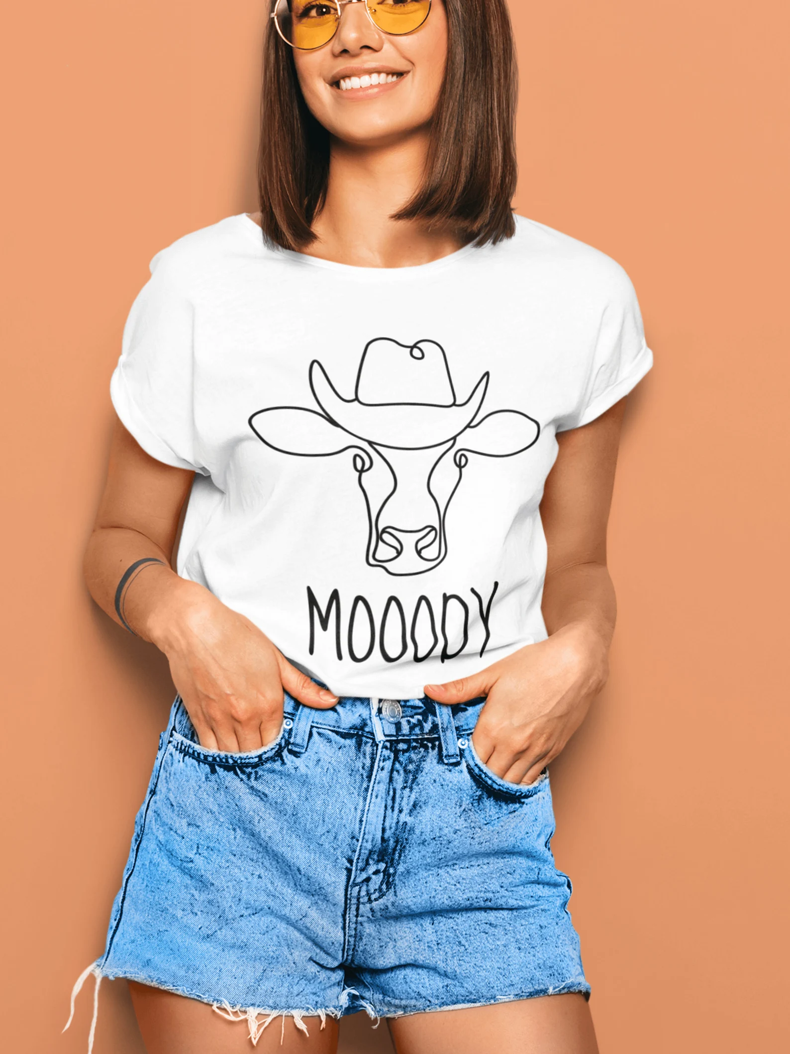 Simple white t-shirt with an outline cow.