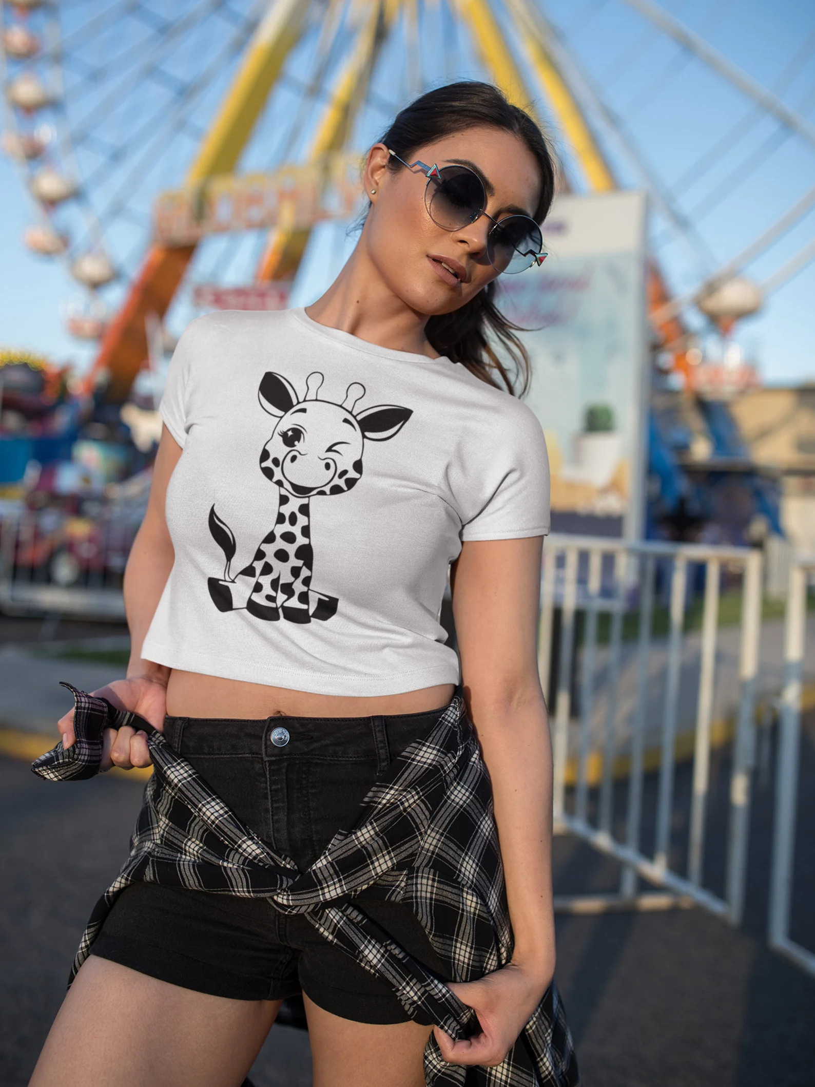 Woman wearing a shirt with a giraffe on it.