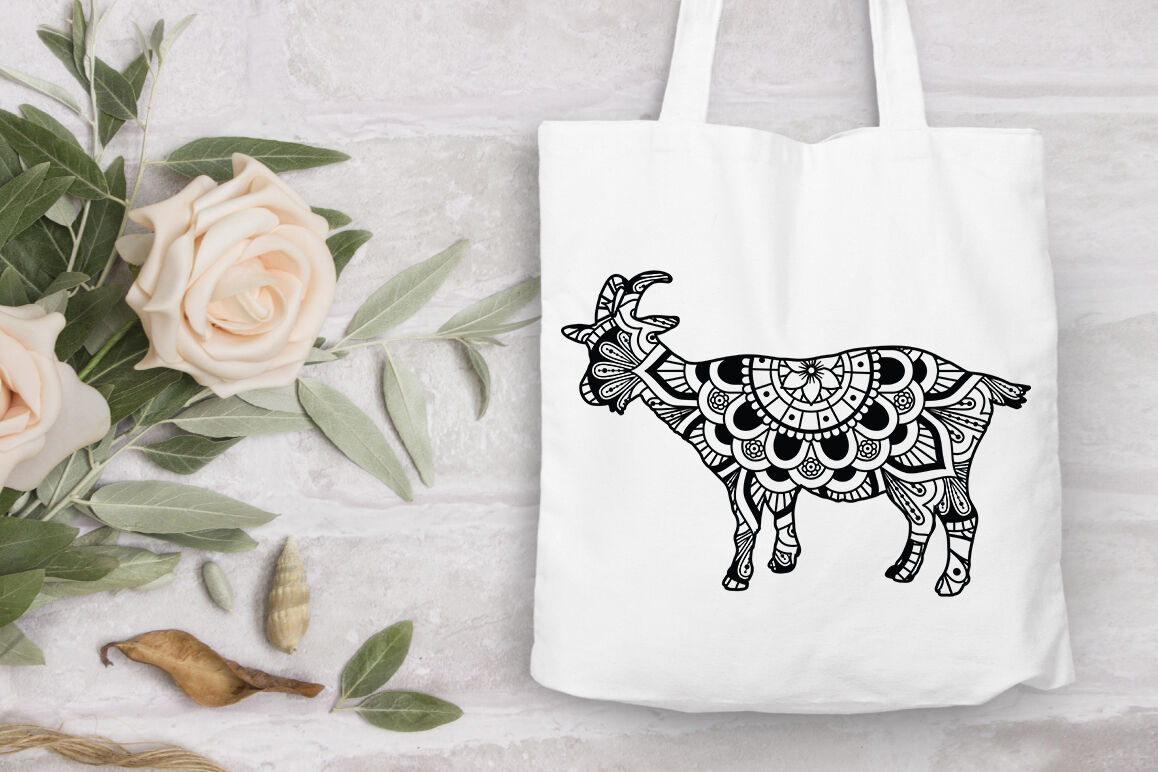 White tote bag with a black and white drawing of a cow.