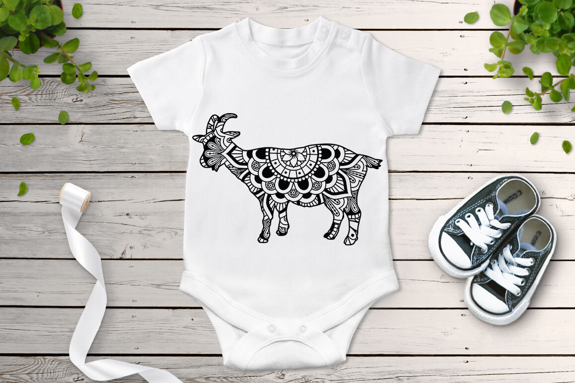 White bodysuit with a black and white graphic of a cow.