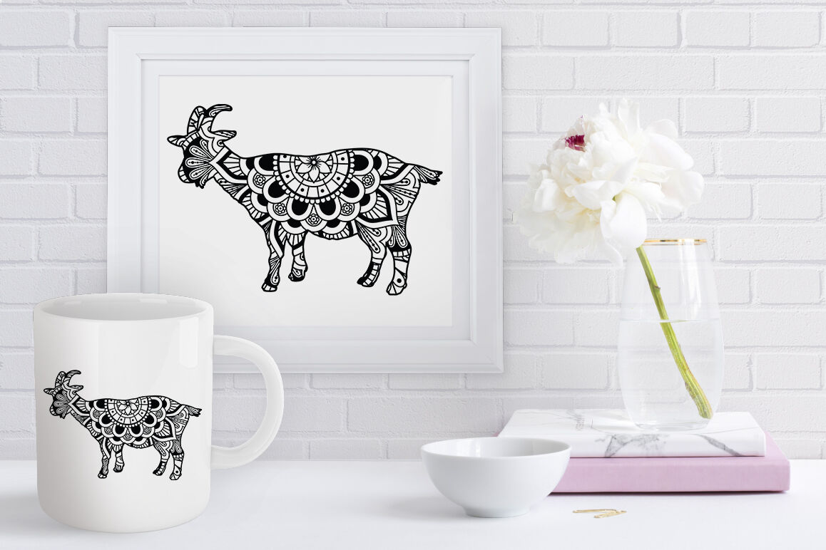 Picture of a cow on a wall next to a vase of flowers.