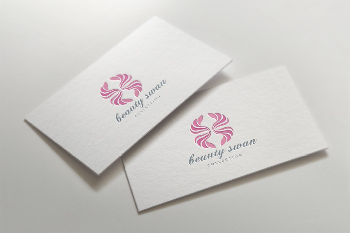 Two business cards with pink swans.