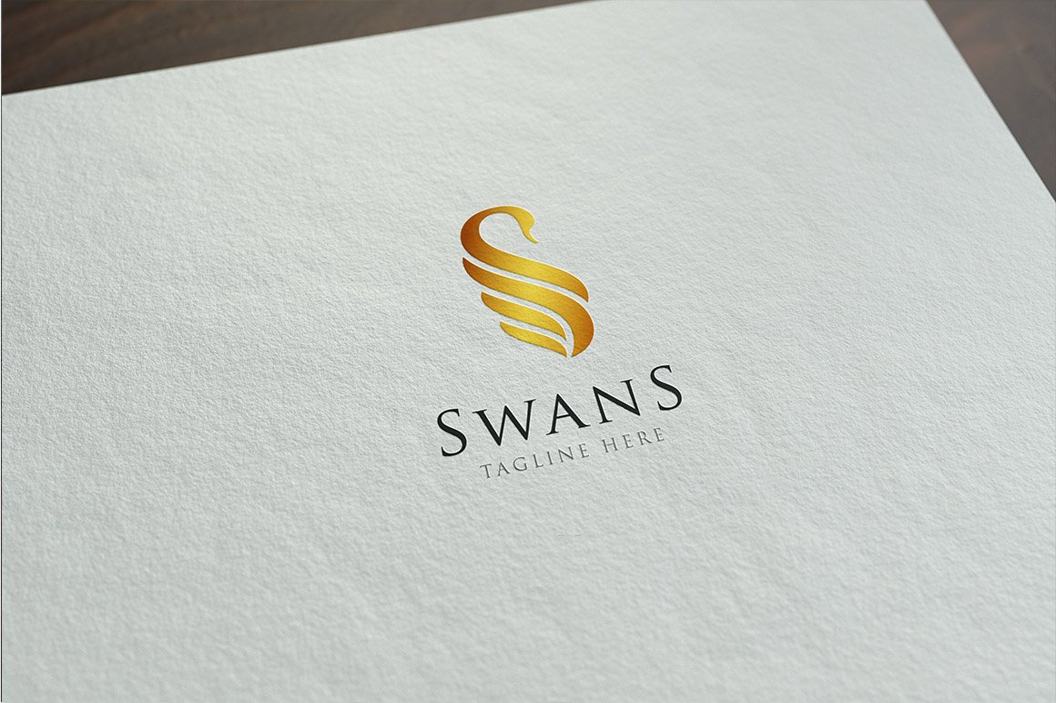 Matte white paper with gold swan logo.