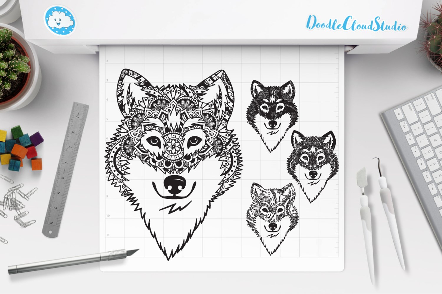 Drawing of three wolfs on a sheet of paper.