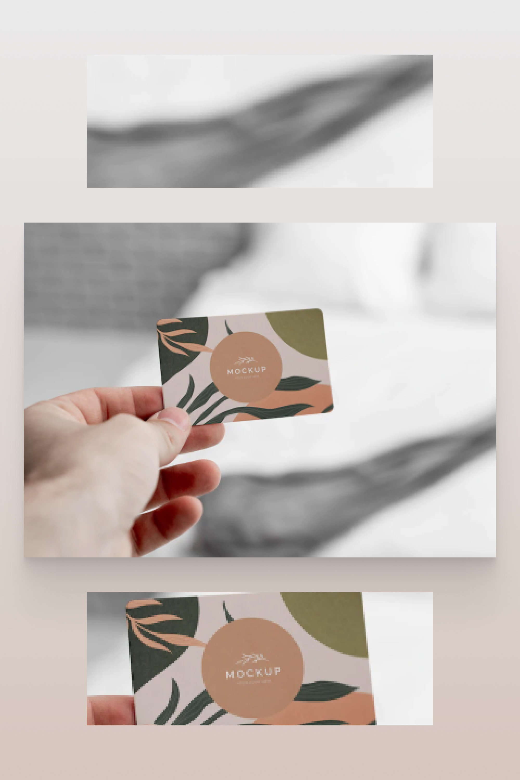 Color business card in hand on white and gray background.