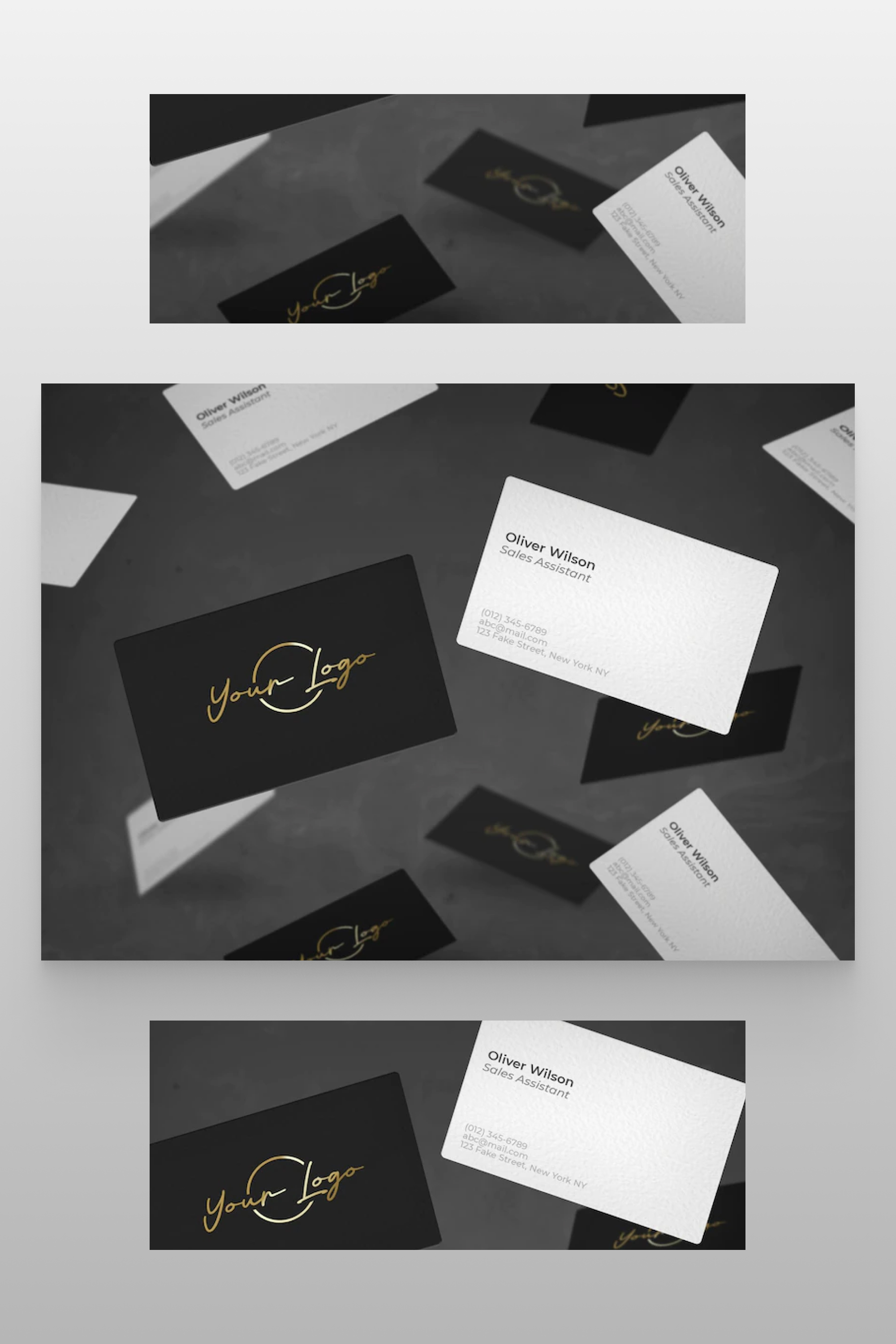 white and black with gold logo business cards on a gray table.