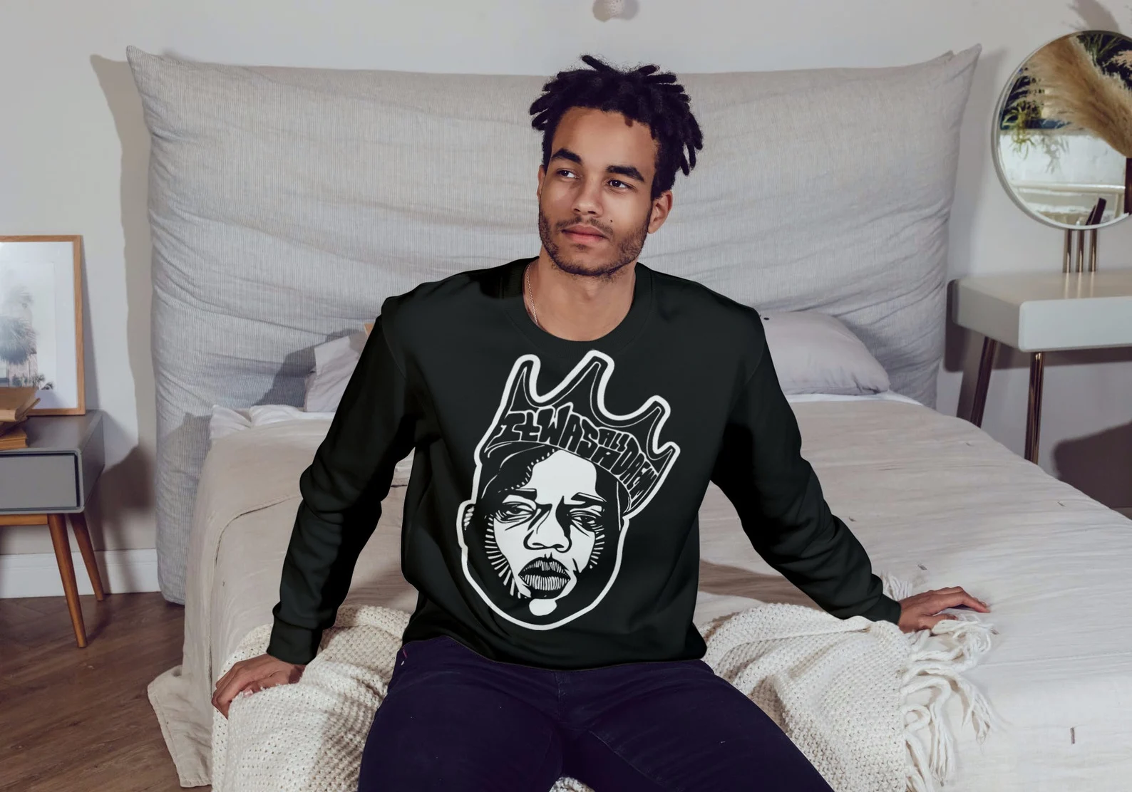 Classic black sweater with white Tupac illustration.