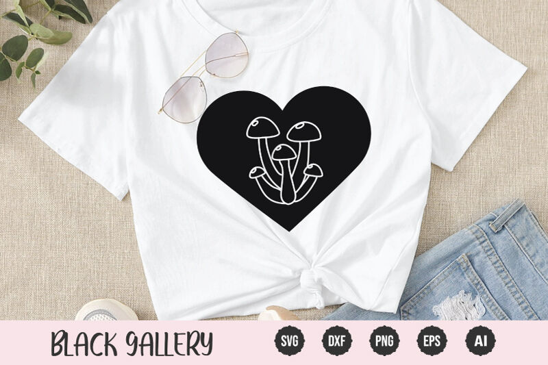 White t-shirt with a black heart and mushrooms.