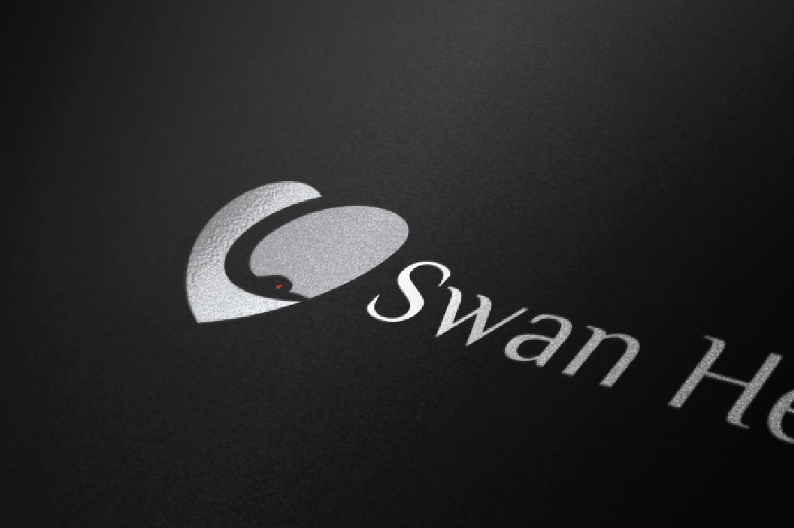 Matte black background with silver swan heart logo.