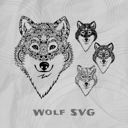 Picture of three wolf heads on a sheet of paper.