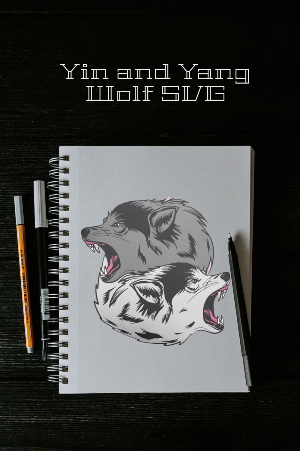 Notebook with a drawing of two wolfs on it.