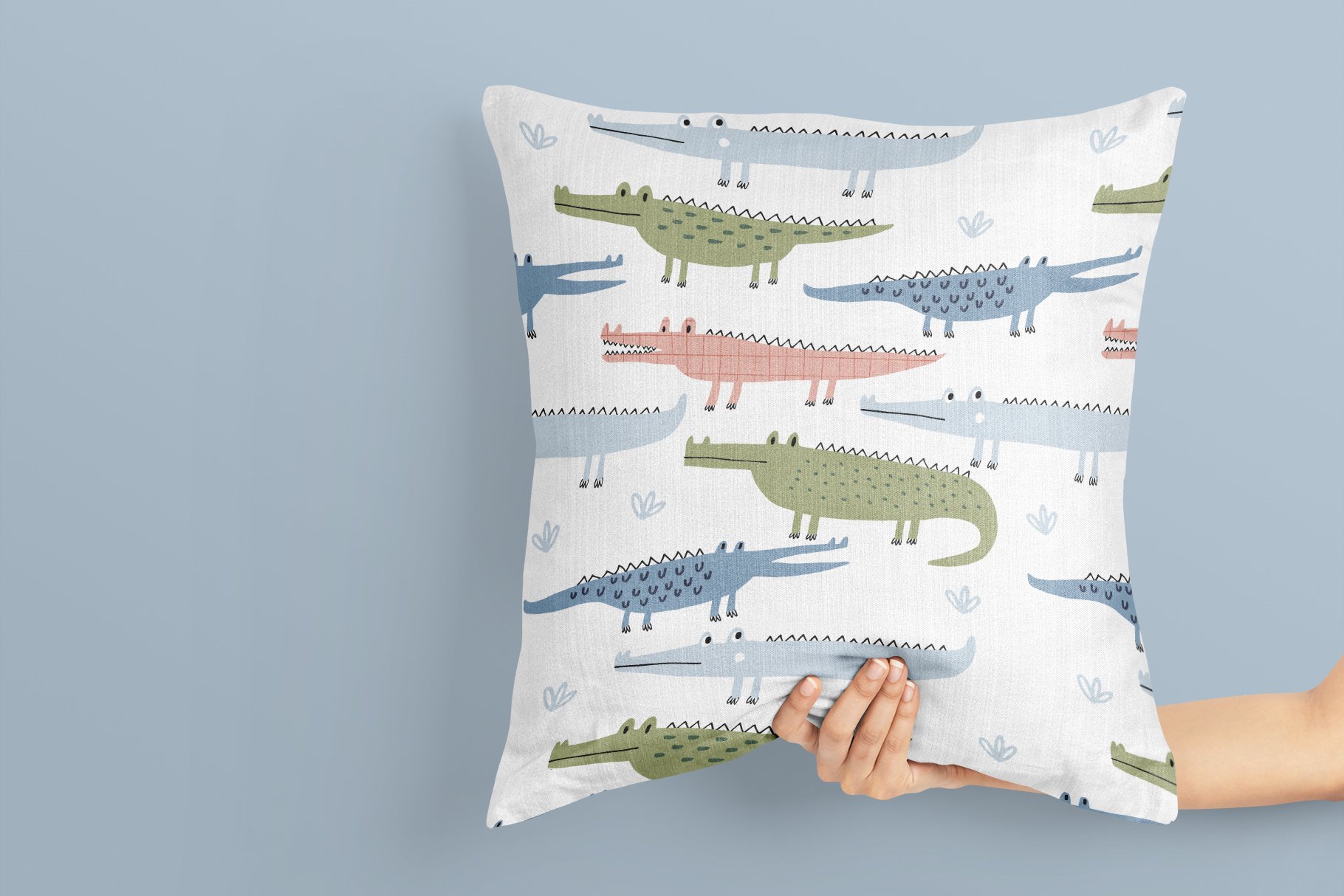 White pillow with cool bright crocodiles.