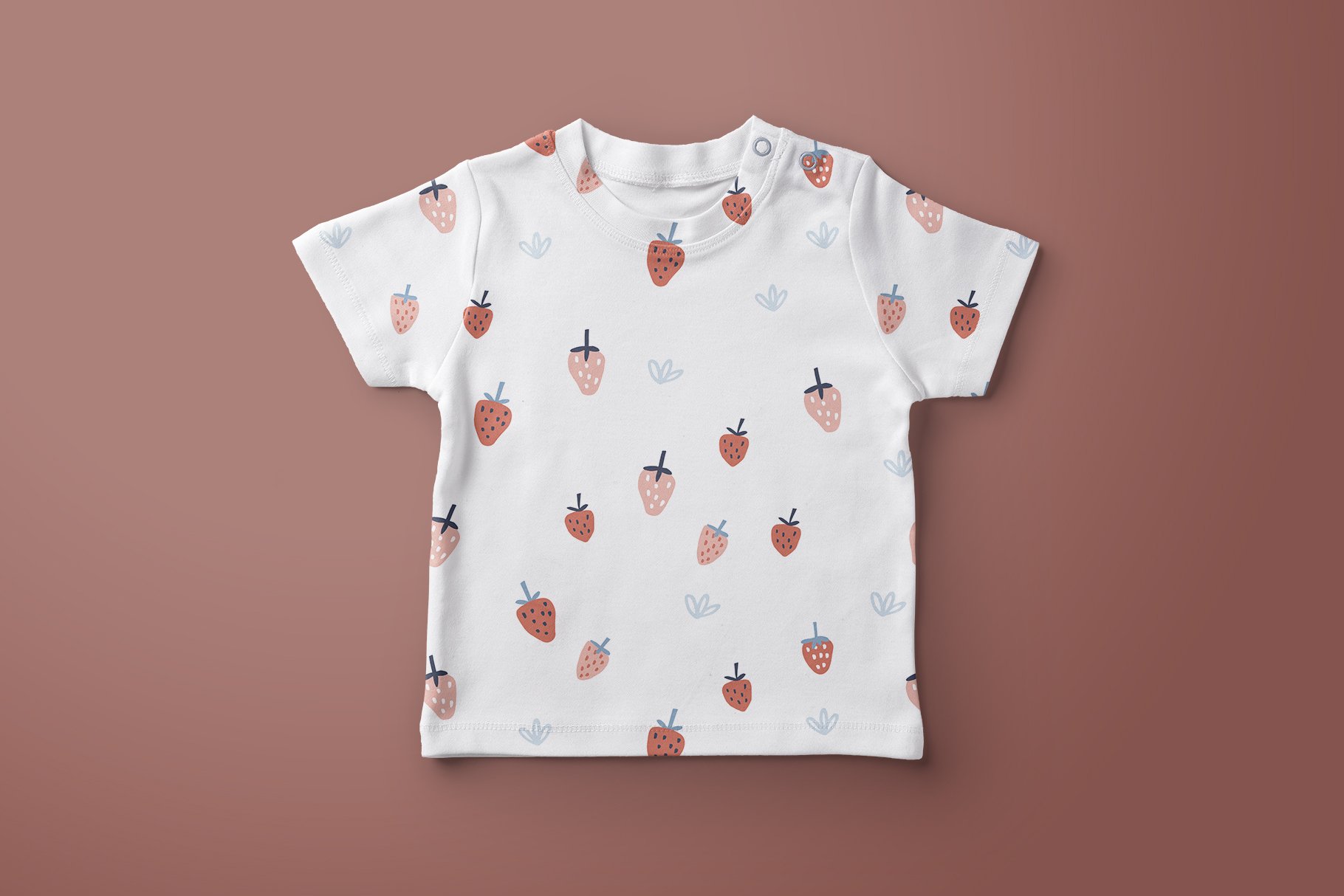 White kid's t-shirt with small strawberries.