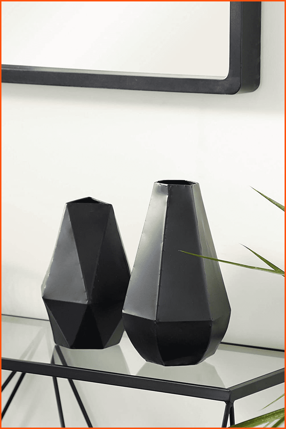 Black Contemporary Geometric Metal Vases on the table.