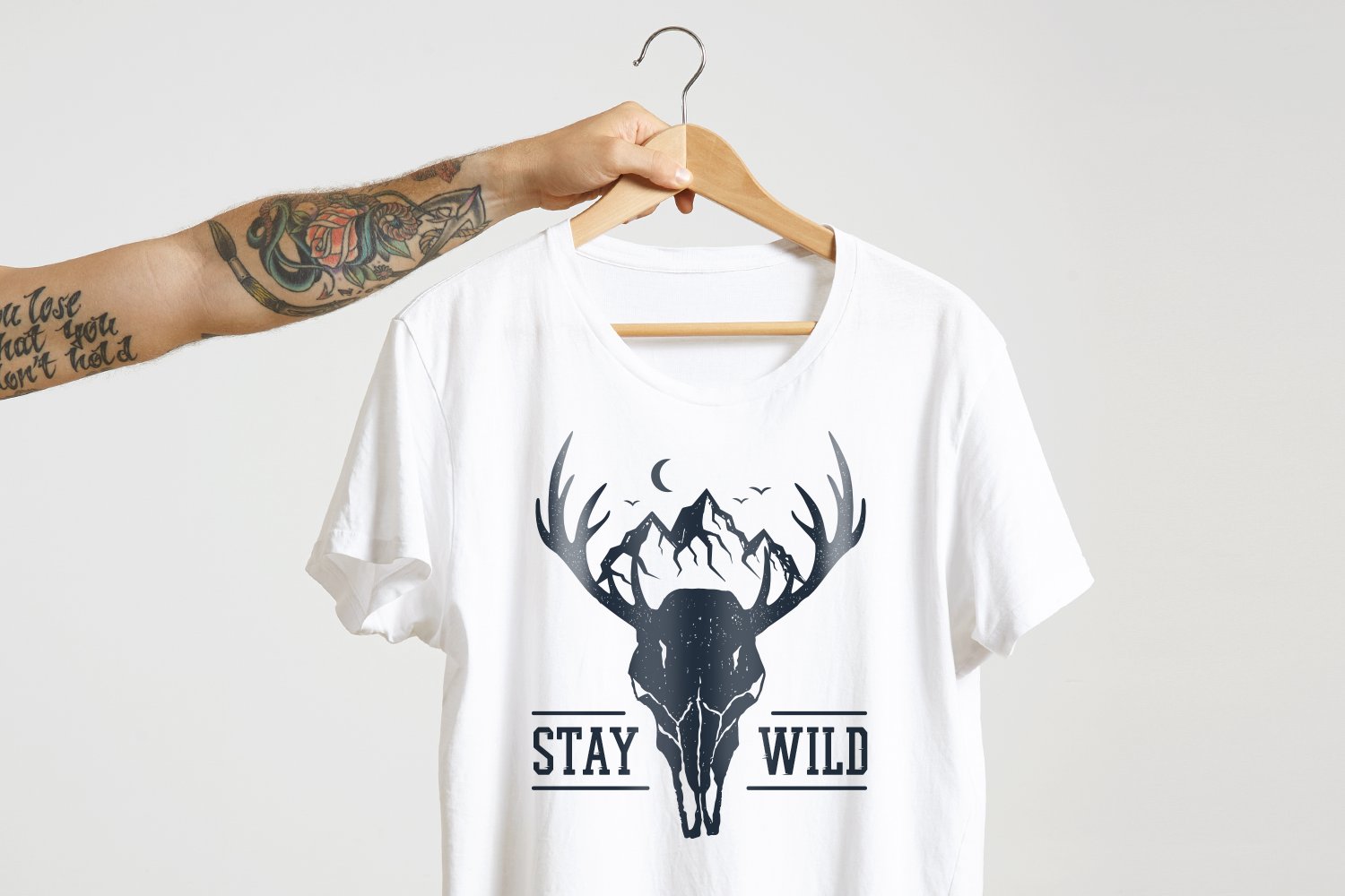 White t-shirt with a black deer.