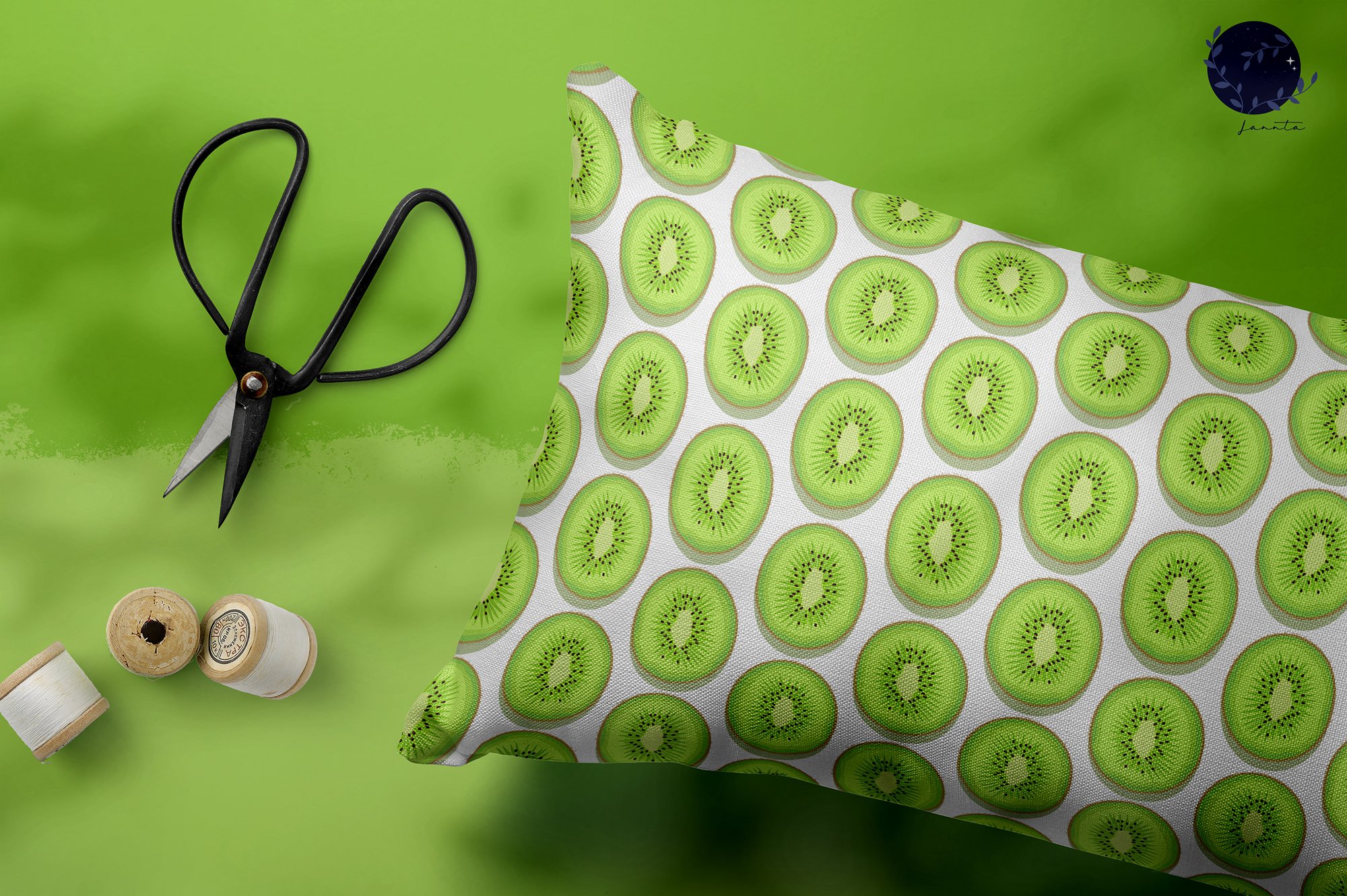 White pillow with the green kiwis.
