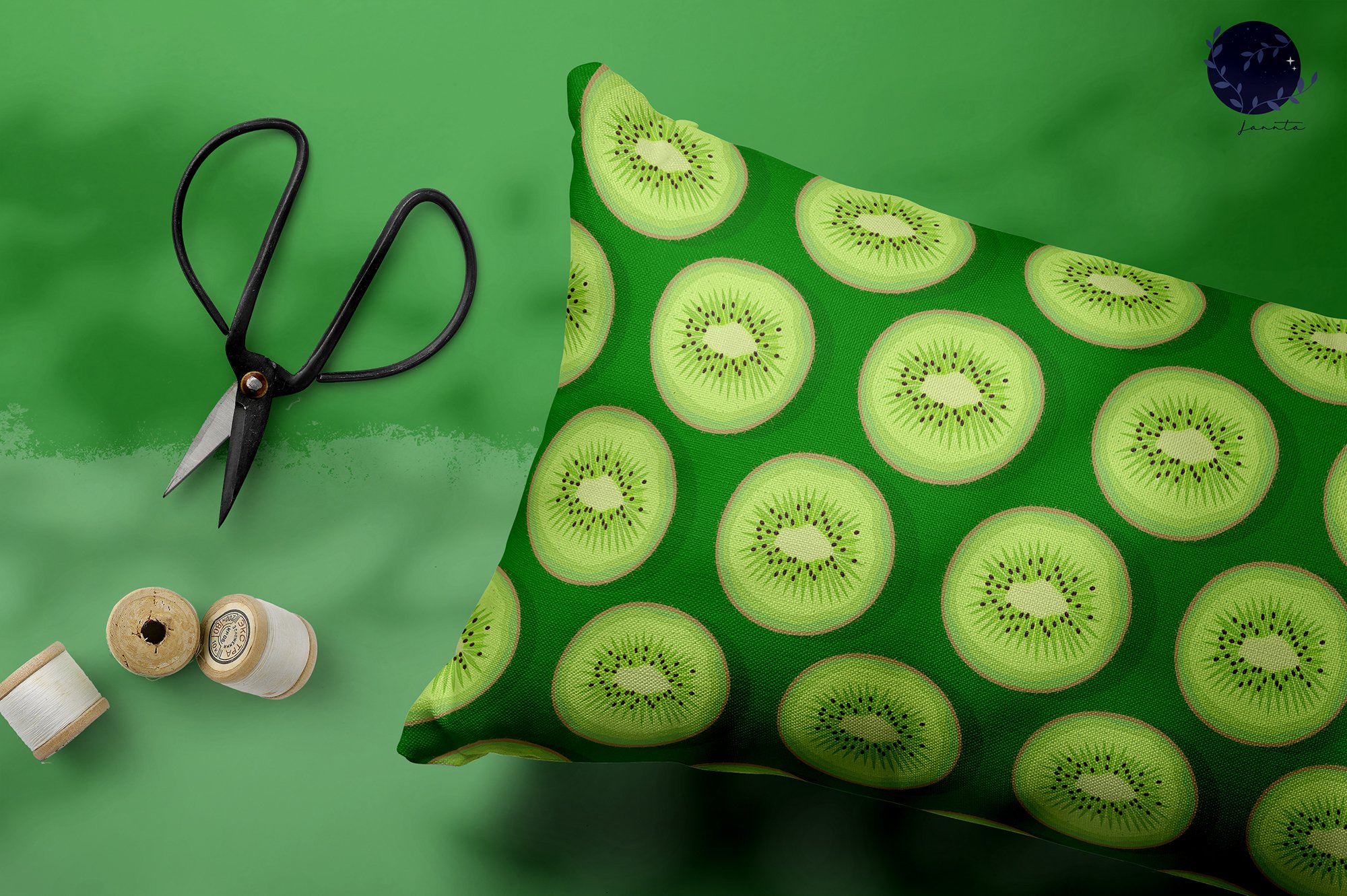 Dark green pillow with light green kiwis.