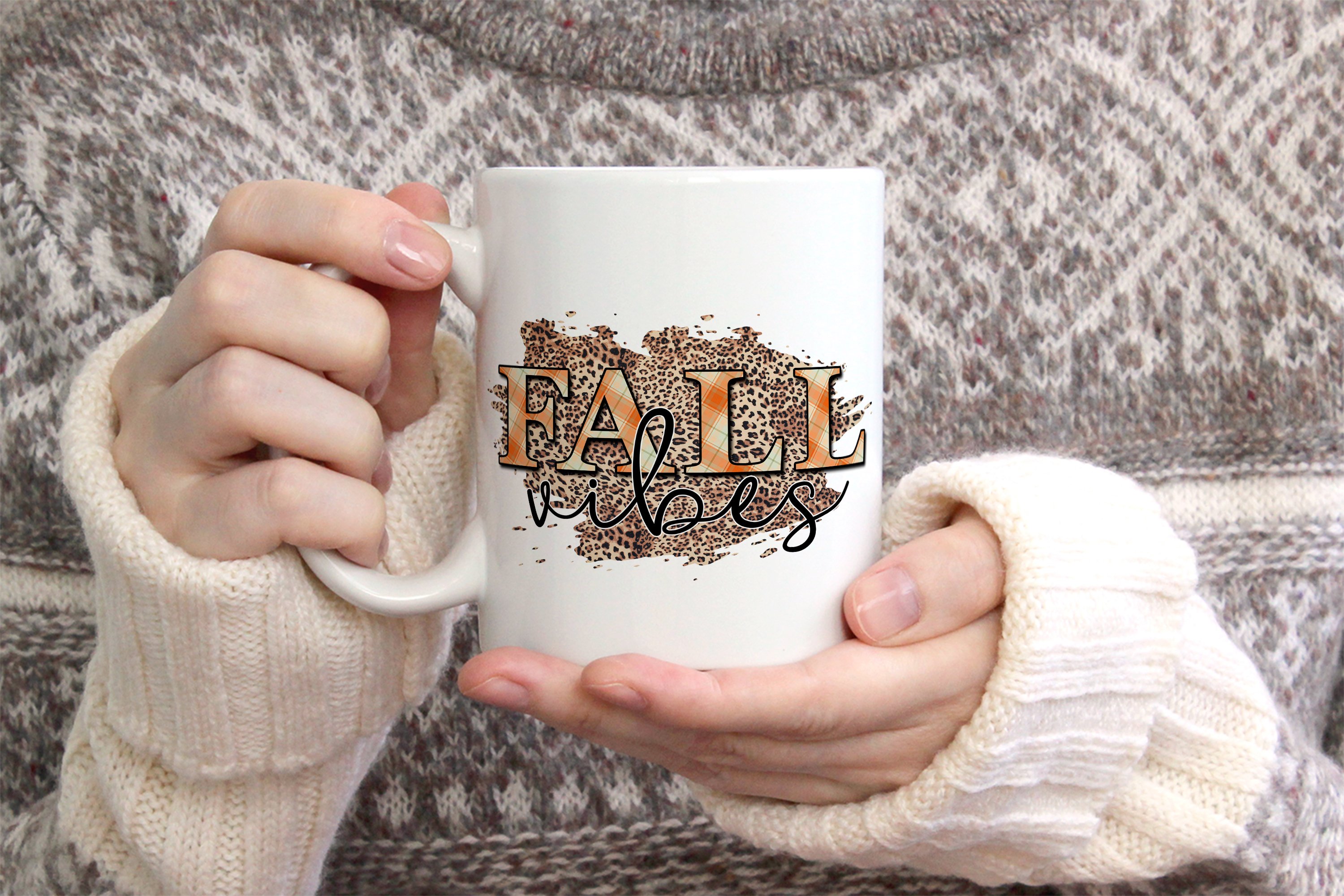 Big white cup with fall illustration.