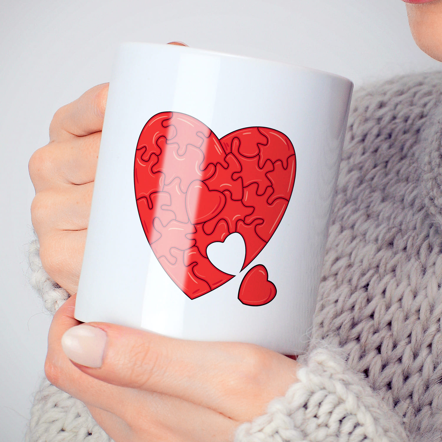 Heart puzzle svg design on the cup.
