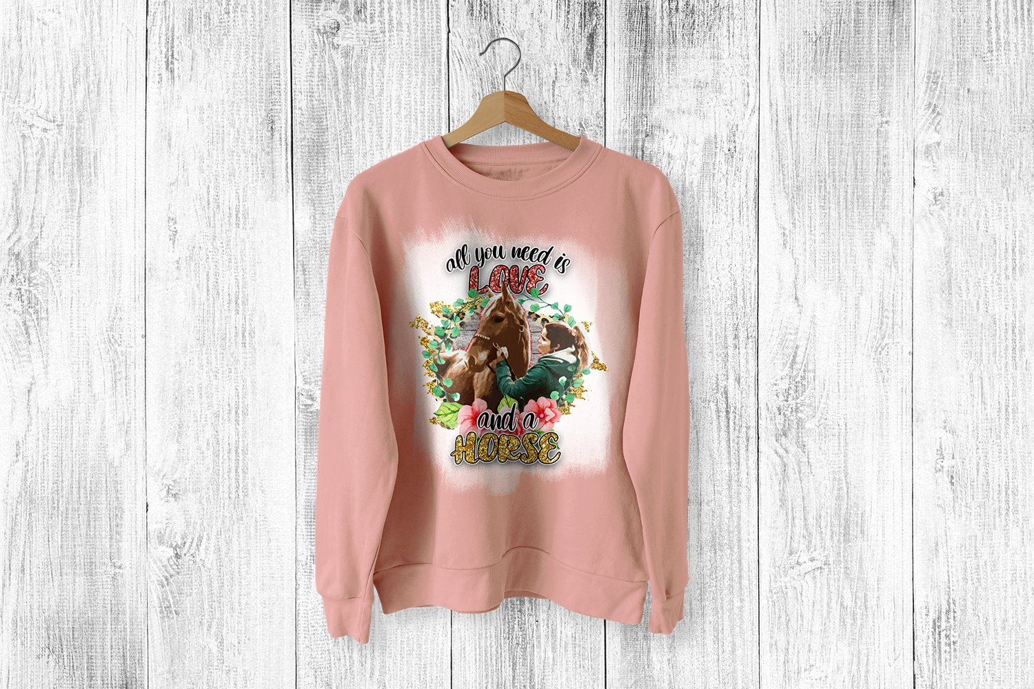 Peach sweatshirt with horse illustration.