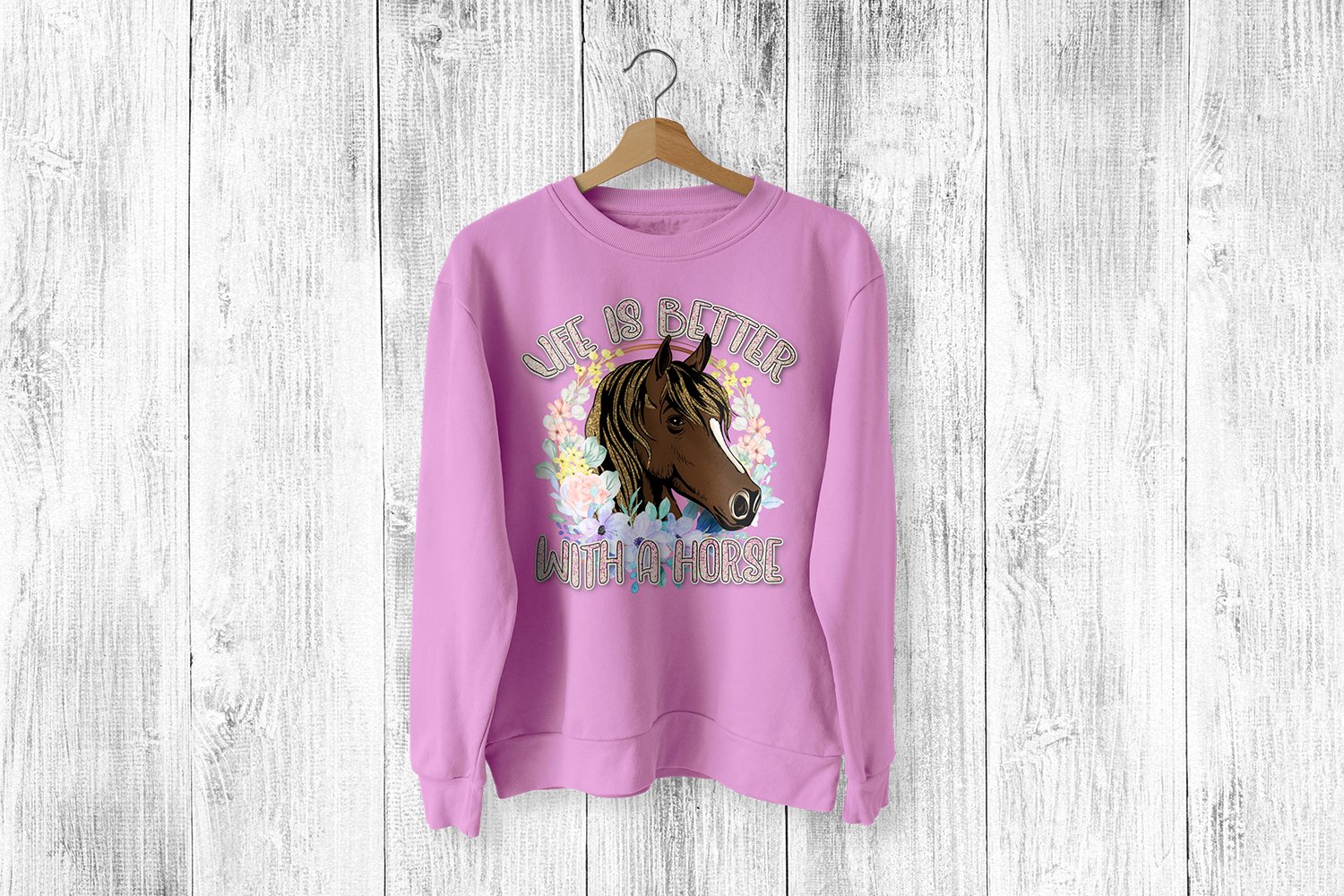Pink sweatshirt with a horse on it.