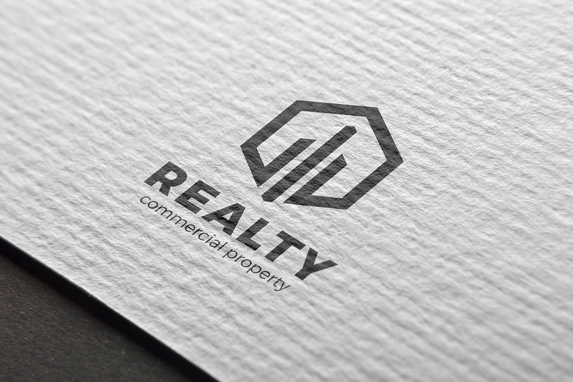 Simple white paper with futuristic black real estate logo.