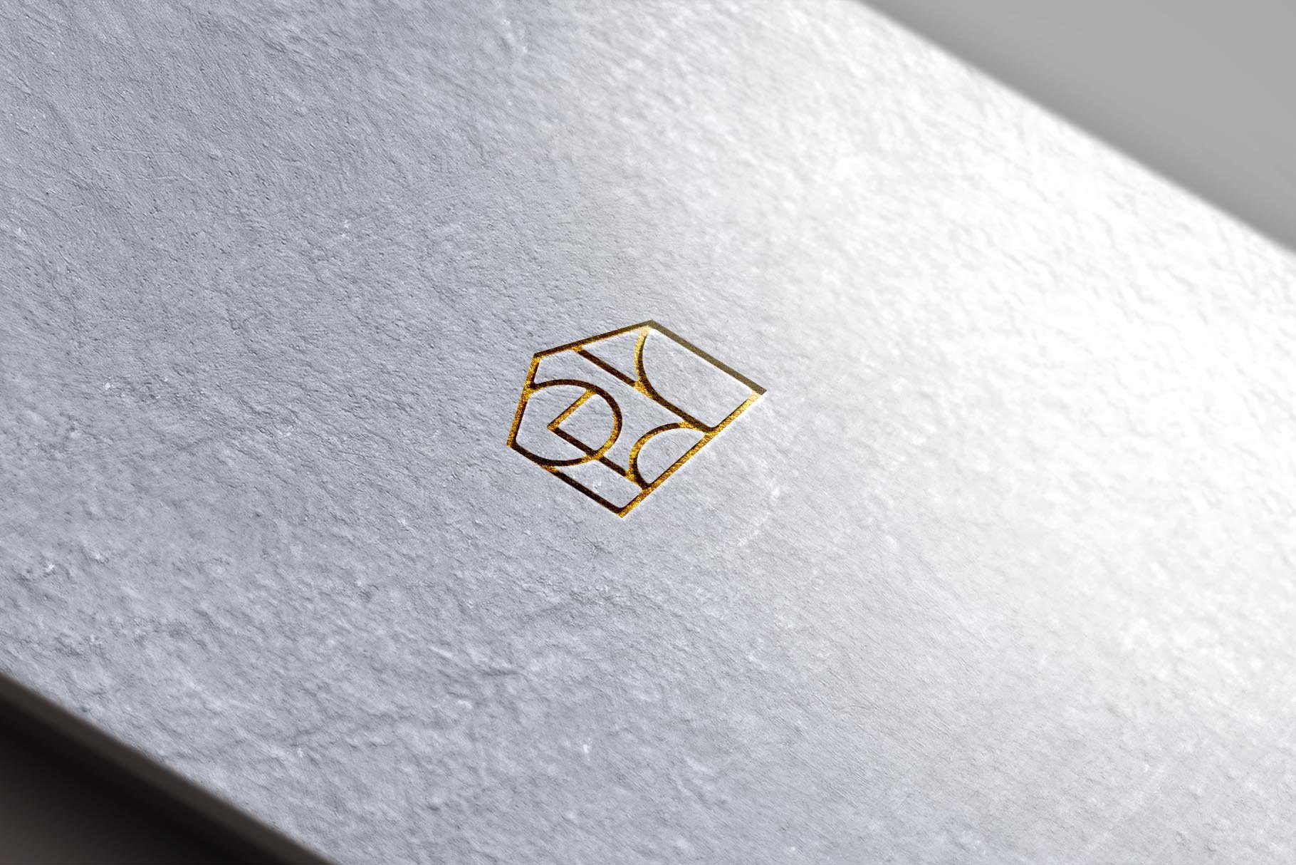 Light paper with gold logo.