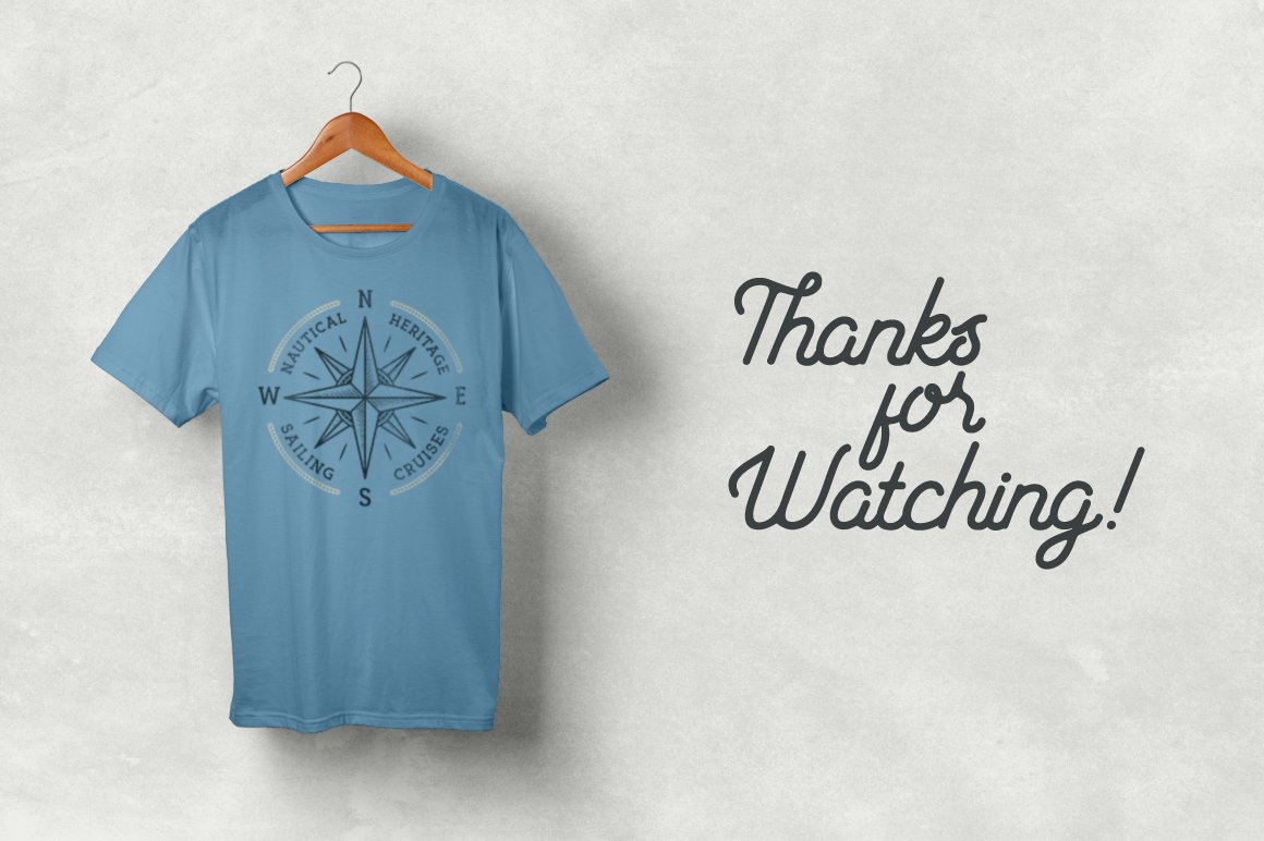 Simple blue t-shirt with a nautical symbol.