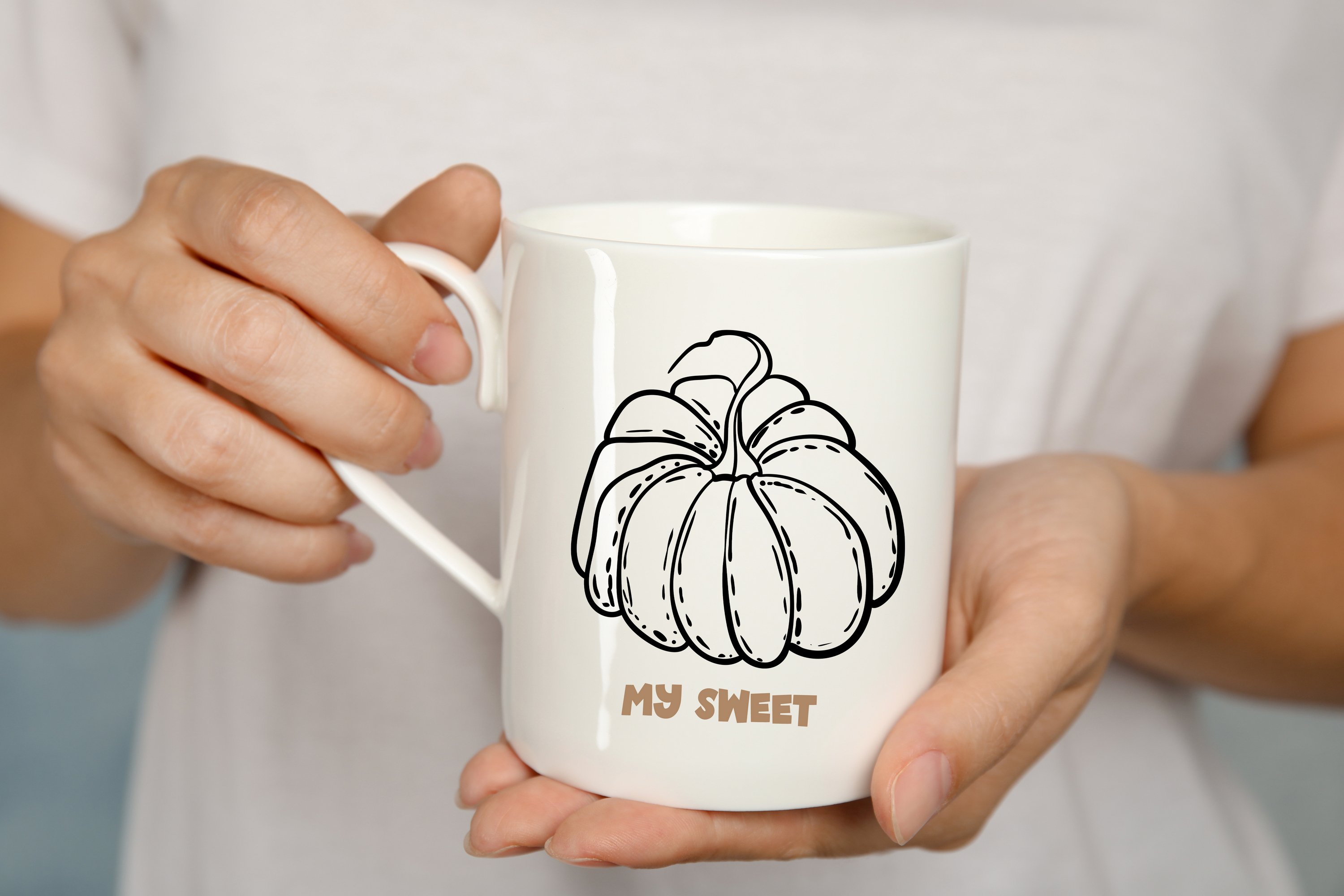 Big white tea cup with a hand drawn pumpkin.