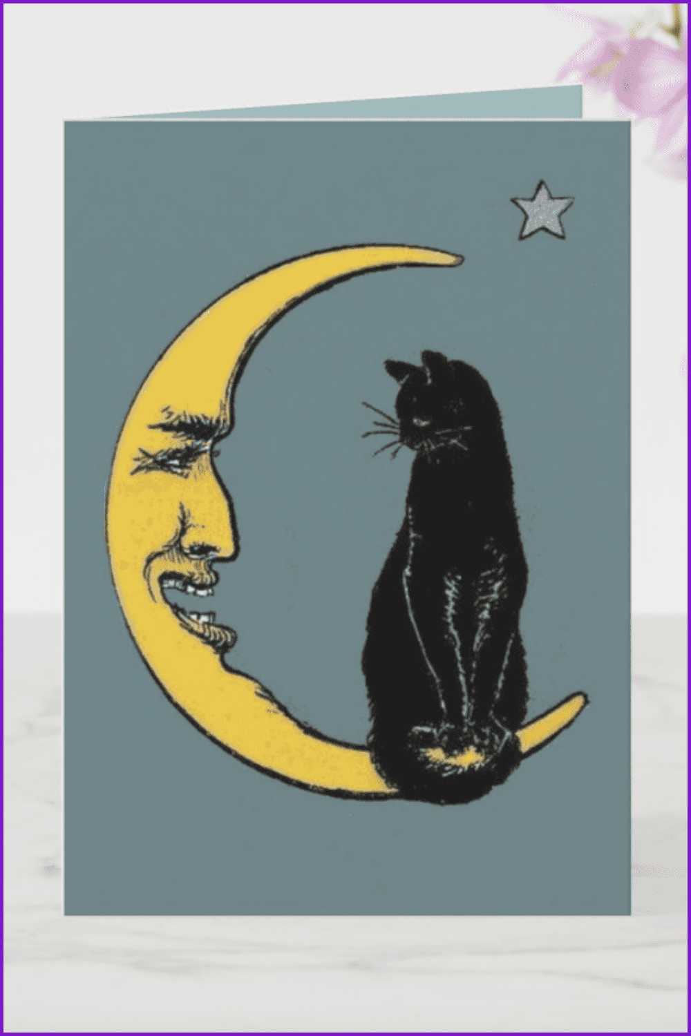 Black cat sits on the horn of the moon.