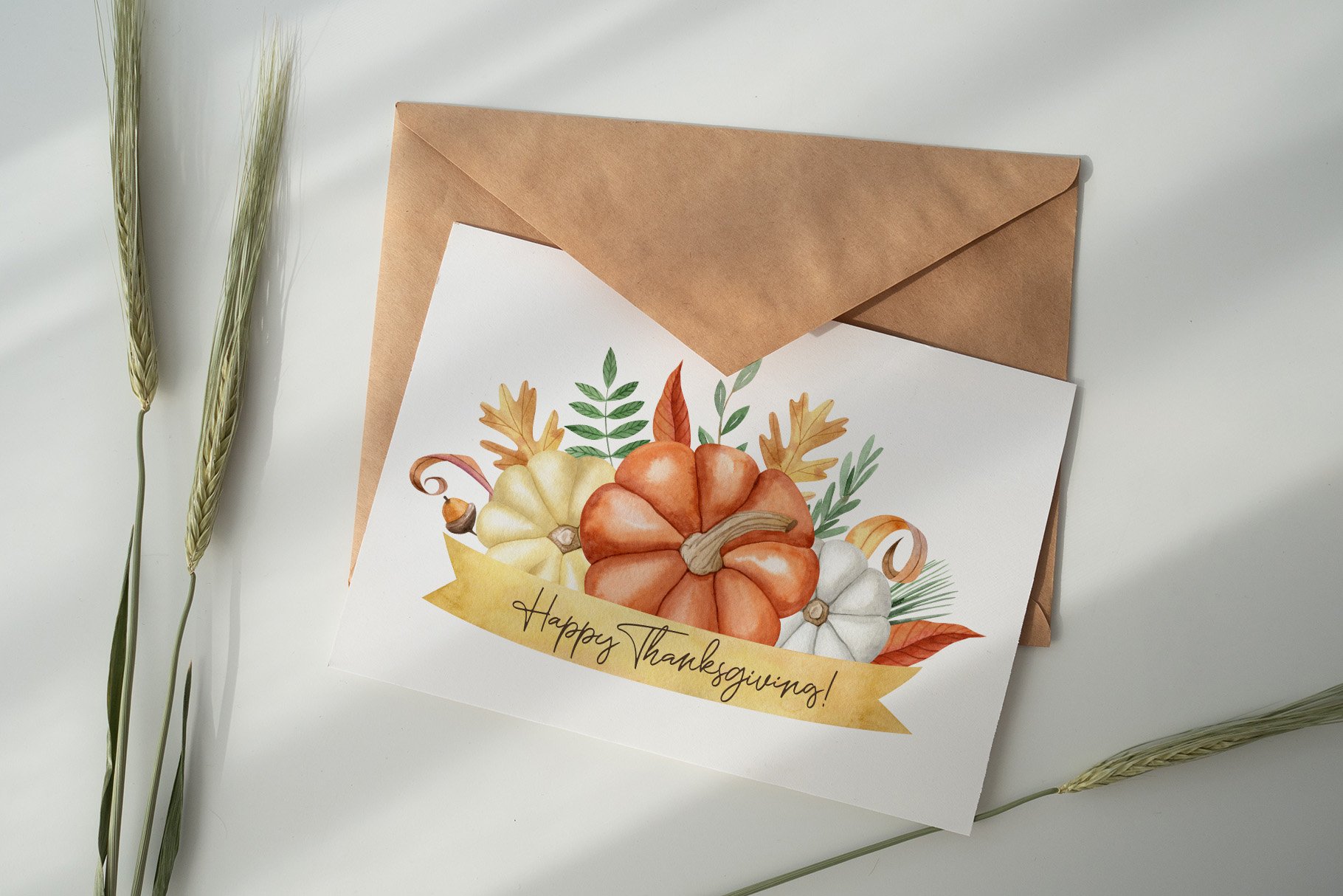 White card with a watercolor pumpkins.