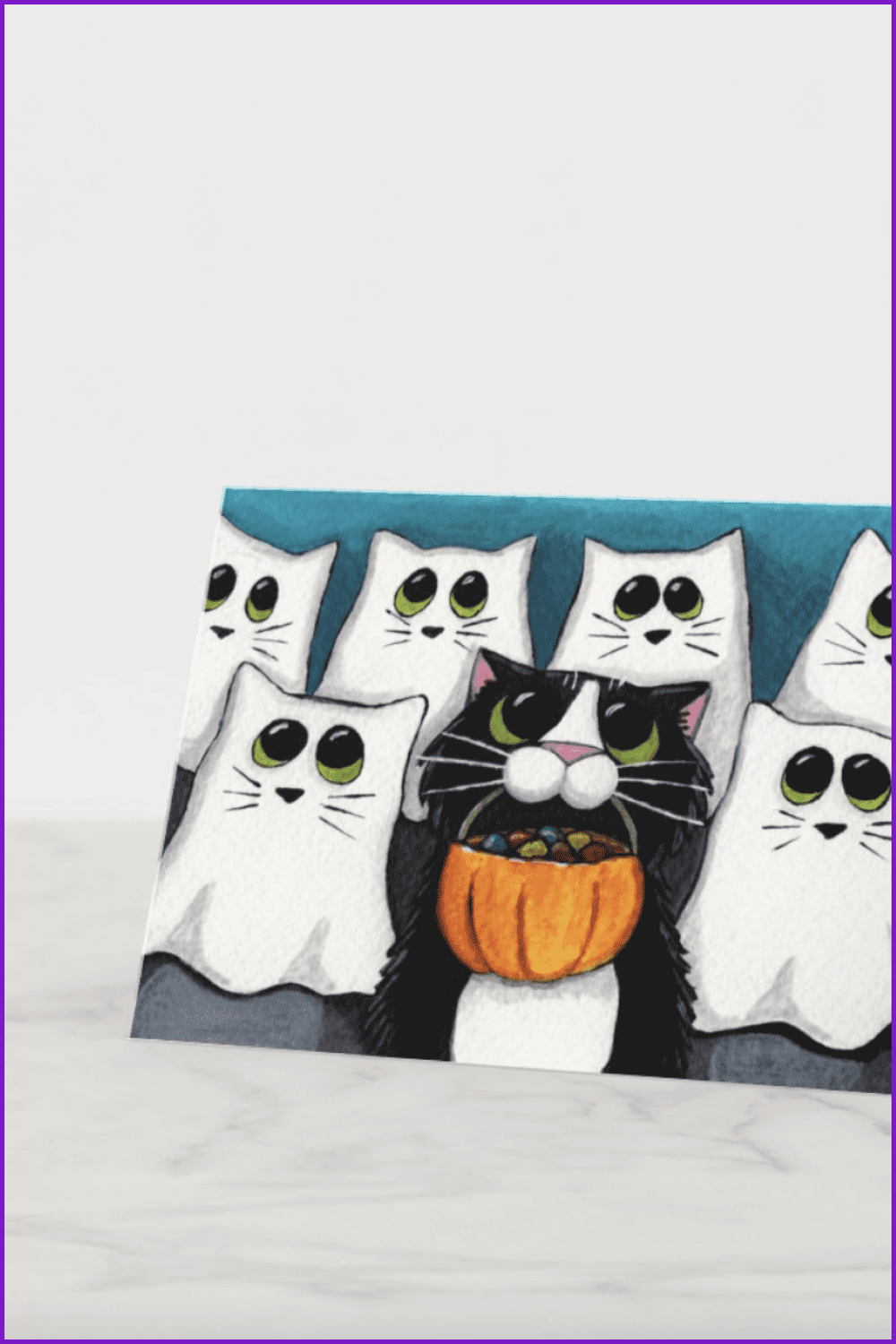 Cats in white ghost capes and a black cat with candy in his mouth.
