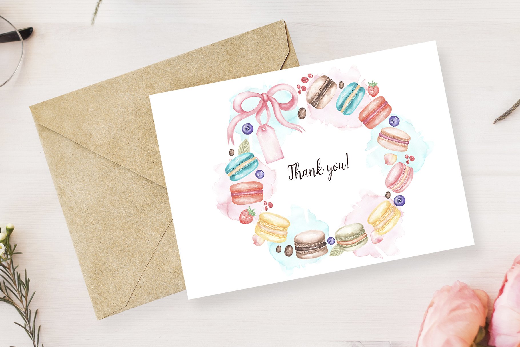 Simple white greeting card with a delicate macaroon illustration.