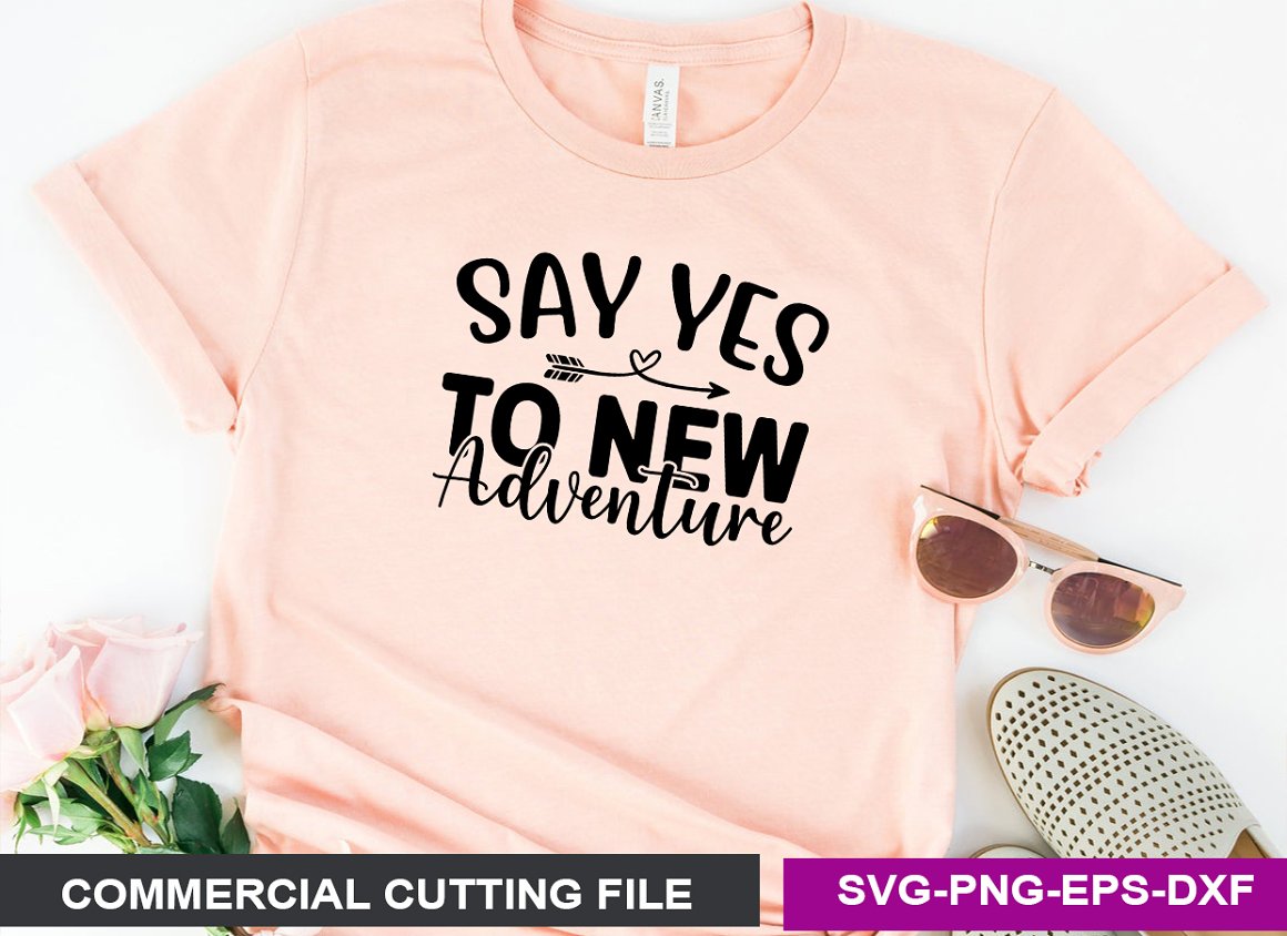 Pink T-shirt with the lettering "Say yes to new adventure".