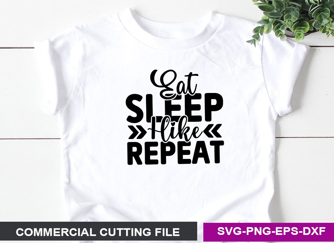 White T-shirt with the lettering "Eat sleep hike repeat".