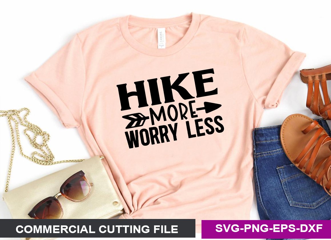 Pink T-shirt with the lettering "Hike more worry less".