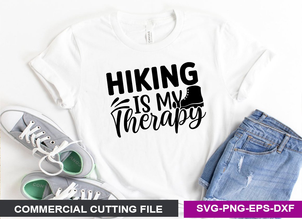 White T-shirt with the lettering "Hiking is my therapy".