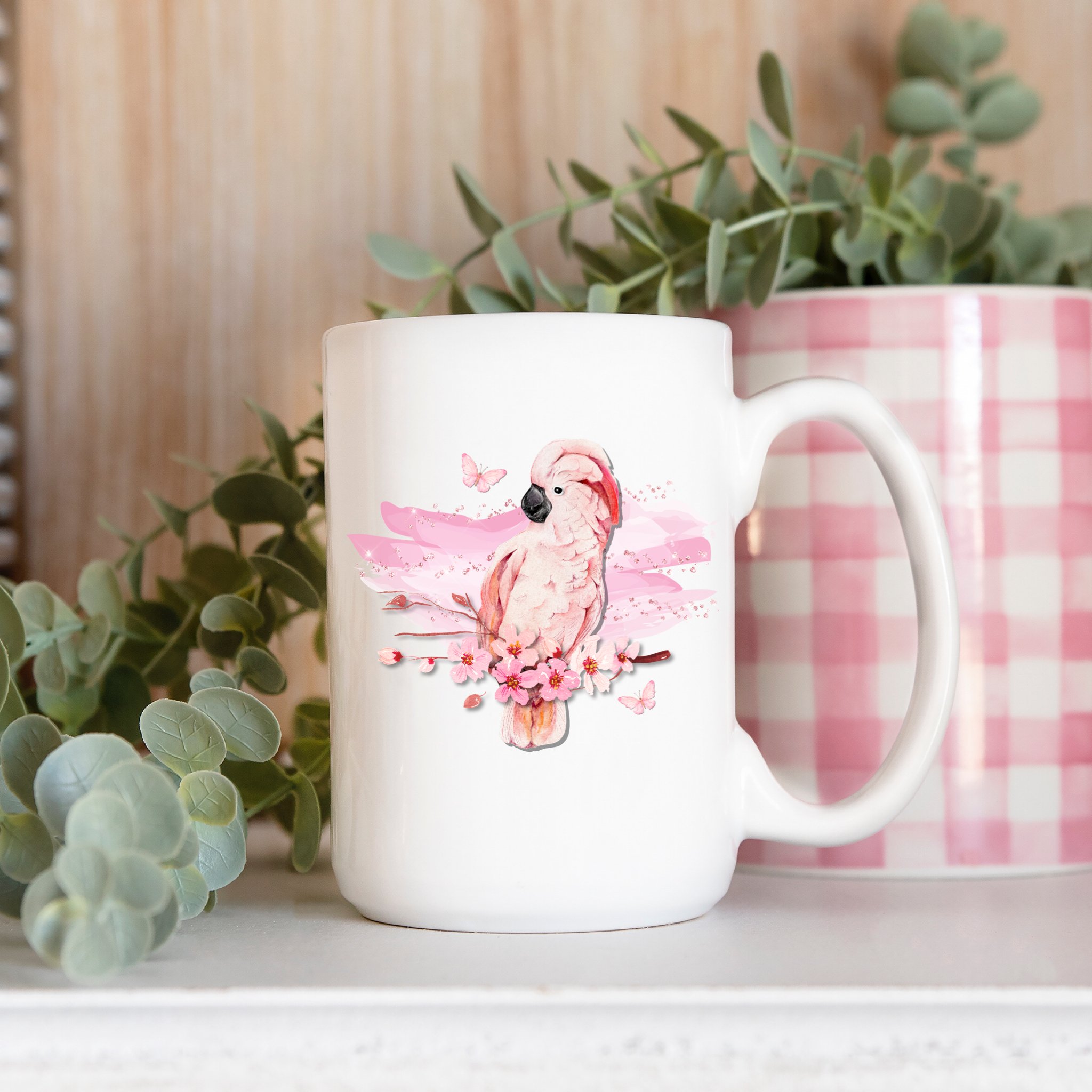 Big white tea cup with pink cockatoo.