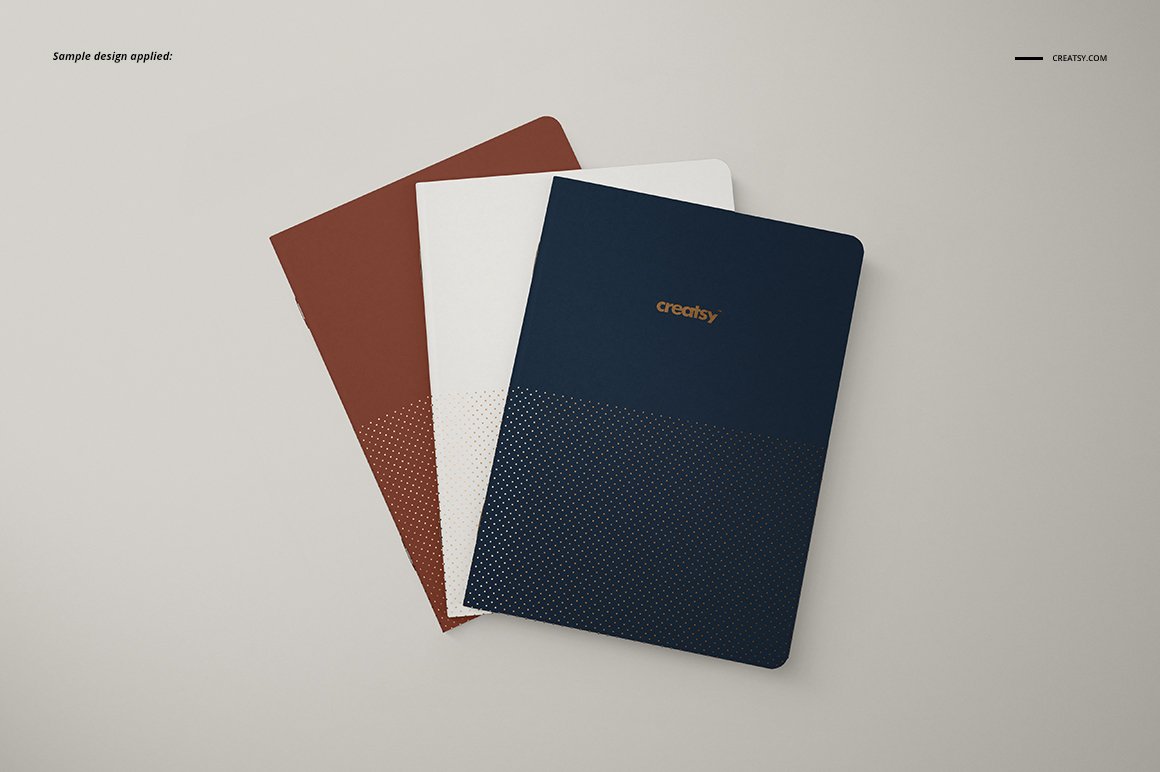 Images of a5 classic notebooks of three colors with a wonderful design.