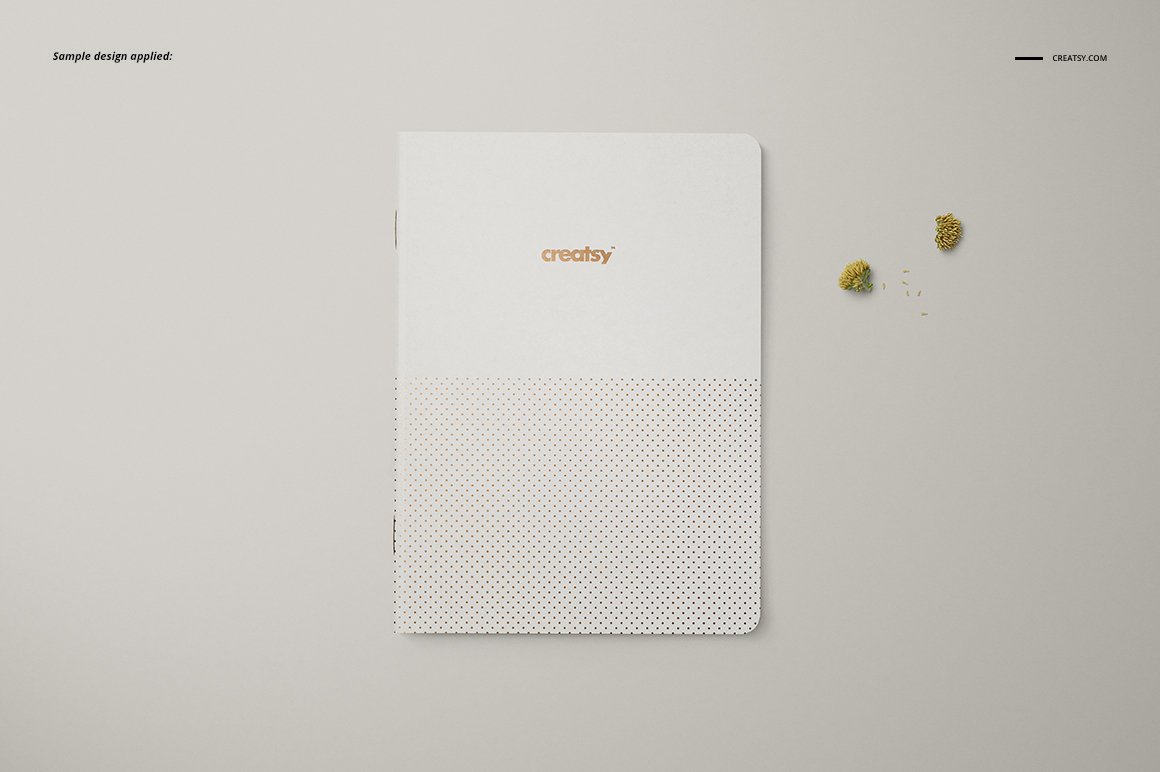 Images of a white color a5 classic notebook with a colorful design.