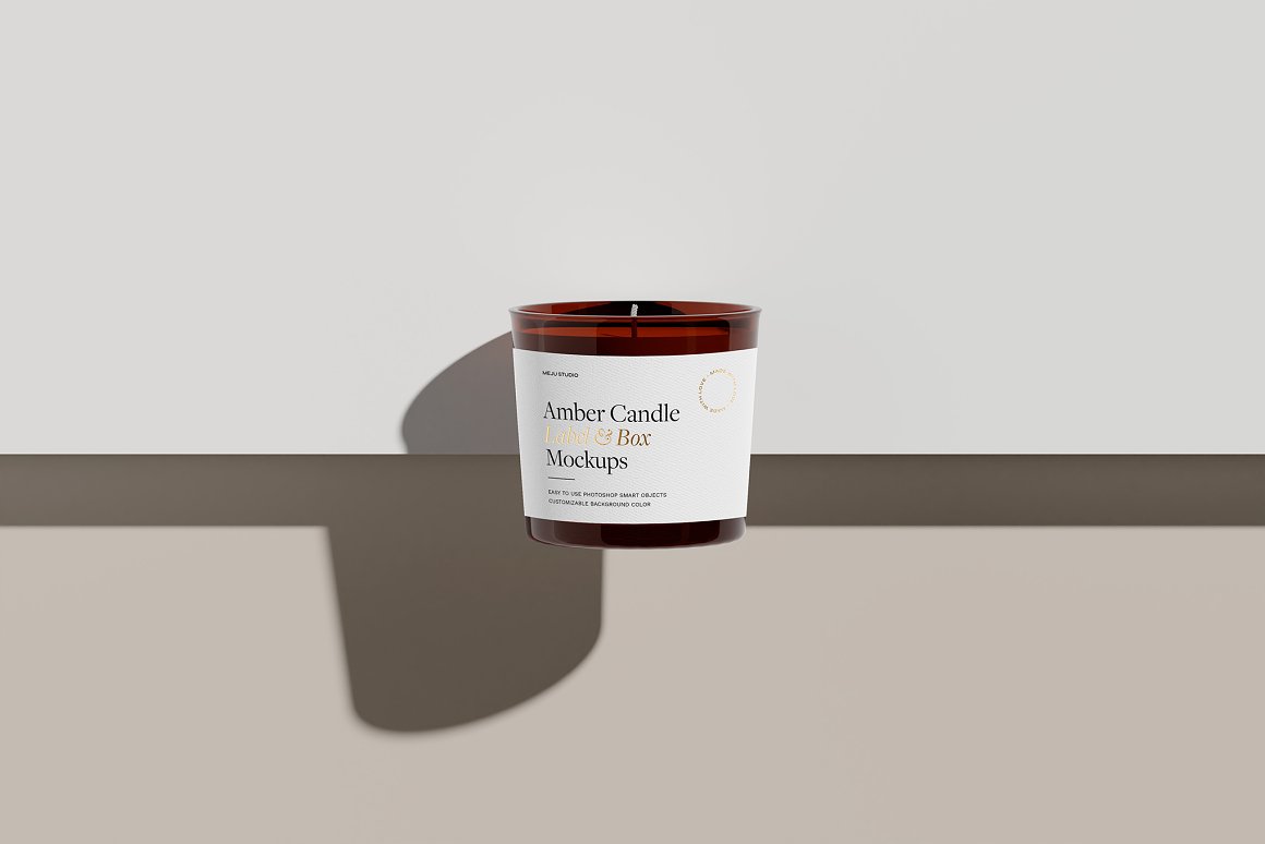 Amber Glass Candle with white label and the lettering "Amber Candle Label & Box Mockups".