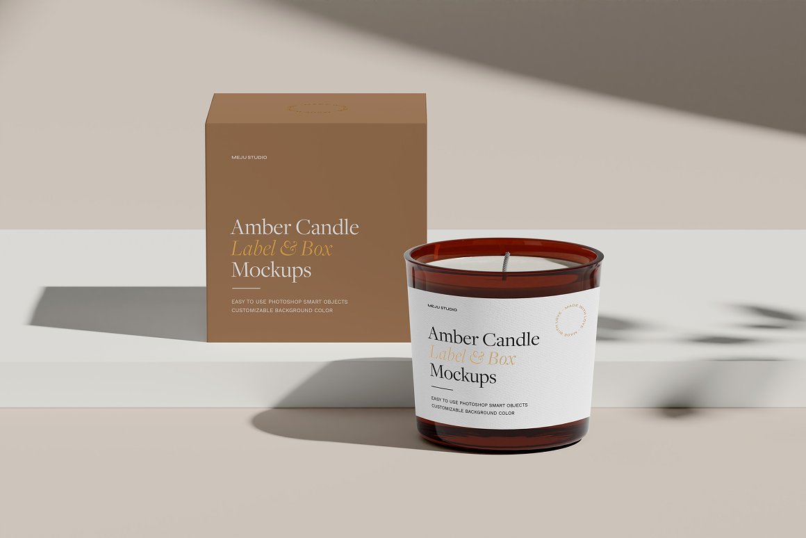 Amber glass candle with white label and beige box with the lettering "Amber Candle Label & Box Mockups".