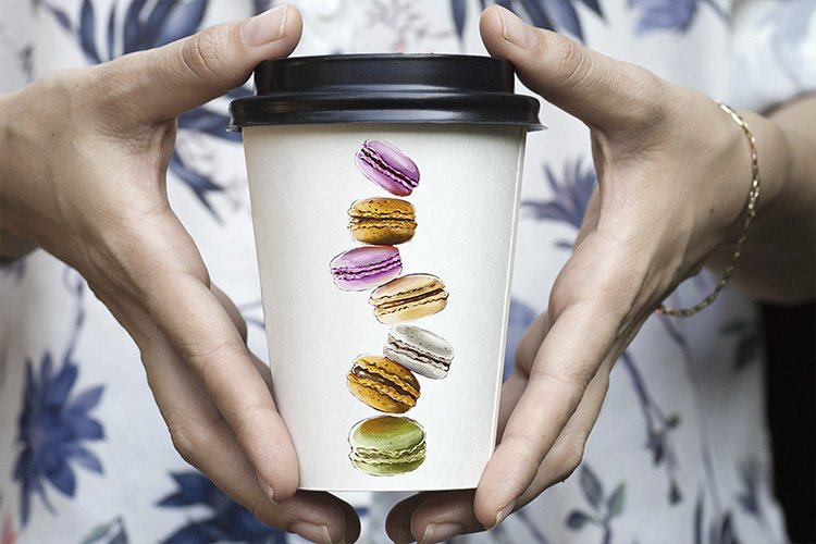 White coffee cup with macaroons prints.
