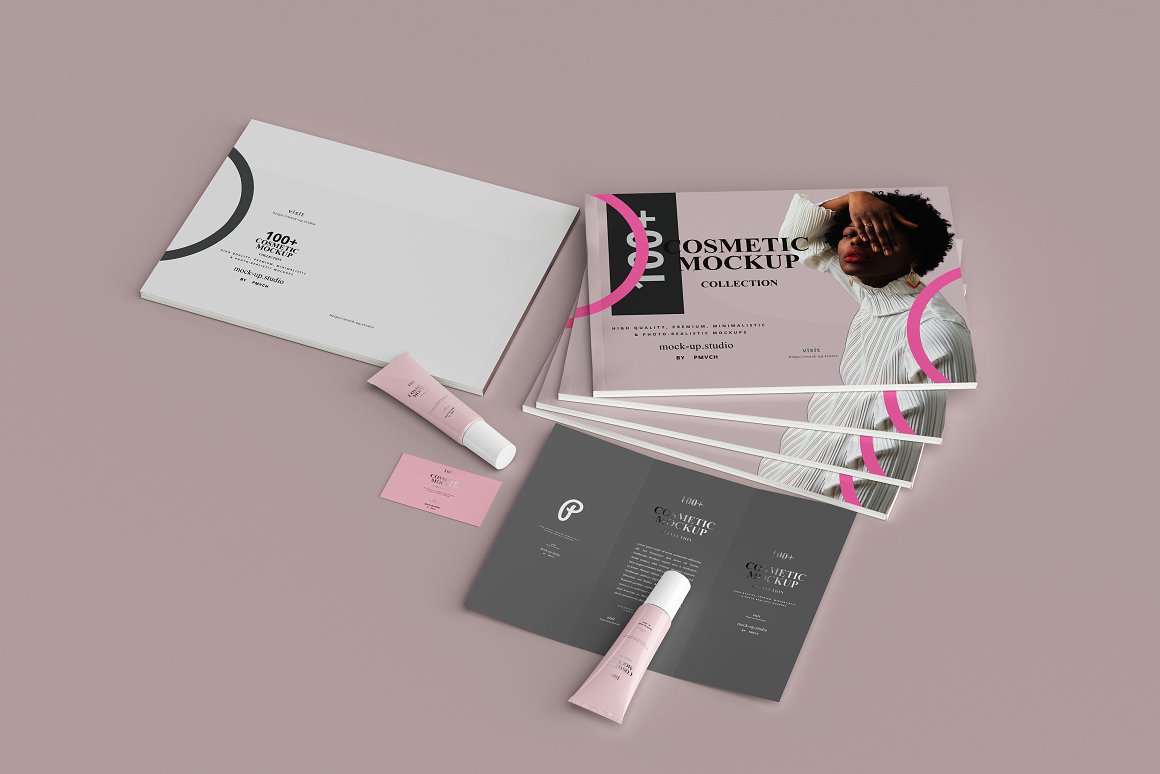 Set of 5 magazines, blush, 2 pink skincare products, a pink business card and a dark gray brochure.