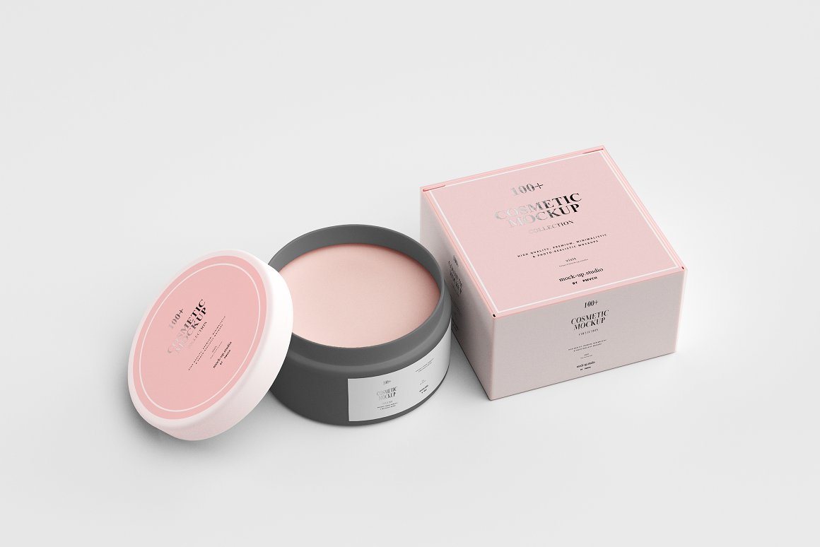 A dark gray jar with a white and pink lid and a pink box for a skin care product.